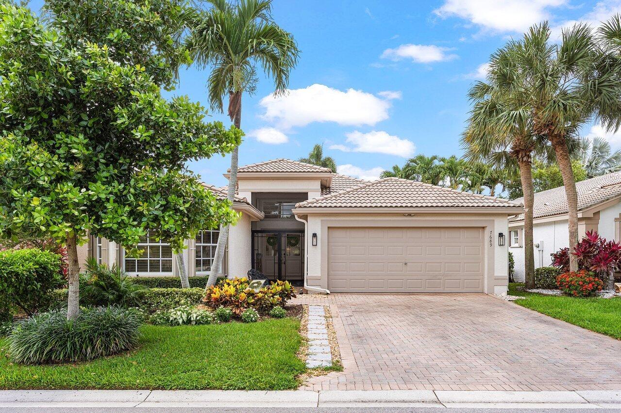 Behold this Coral model that sits on a meticulously landscaped, lakefront & private lot.  You'll feel right at home as you enter through the new, impact-rated double door entry. This open and light floorplan features a gorgeous new kitchen, including all-wood cabinetry, quartz tops, buffet, and bar/additional pantry storage. All tile and wood flooring, hi-hat, and accent lighting adds to the luxurious ambiance. Step out back to your tiled and screened-in patio, and enjoy some shaded/covered space to relax or entertain guests. Valencia Lakes is a premiere GL homes community which offers an award-winning 55+ lifestyle experience that has been recently been remodeled in 2024. Discover a full-amenity recreational facility that rivals some of the most prestigious resorts in the area.