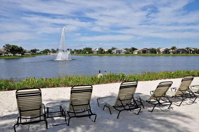 FABULOUS WATER VIEWS, ideally located in the center of the Community, peace & serenity awaits! A Full home auto generator & accordian shutters are a big plus! 3 Bedrooms with great closets make this home the perfect opportunity to enjoy the Valencia lifestyle at a great price! IF YOU HAVE VISION, YOU WILL GRAB THIS AMAZING OPPTY TO CREATE A MILLION DOLLAR HOME WITH A FEW UPGRADES, AT A GREAT PRICE!Walk to 6 Pickleball, 10 Tennis, 3 Bocce crts, 2 indoor racquetball crts, indoor whirlpool, full Serv Bistro, huge tropical pool, resistance and lap pools, beauty salon, state of art fitness Ctr, sauna, steam, billiards, art room, shows, clubs organizations, amenities galore! Full time tennis/pickleball pro and social director! Valencia Shores IS WHERE IT IS HAPPENNING FOR 55+! LOVE IT! AMAZING!