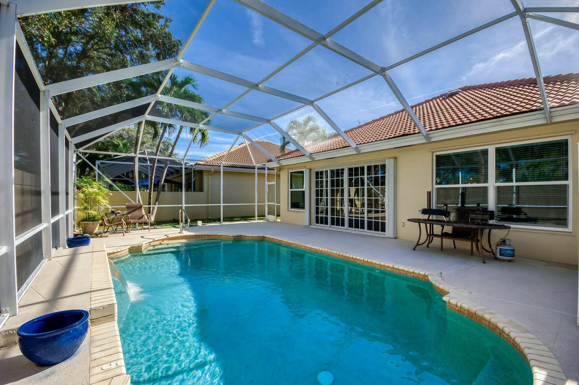 Enjoy the Florida lifestyle in this lovely one-story home in Hamptons at Maplewood, a sought after tree-lined community in the heart of Jupiter. This open concept pool home boasts nearly 2,000 sf and has 3 bedrooms, 2 baths and a 2 car garage. Solid CBS construction and mostly all impact glass. The great room has been updated to a more open floor plan. Tile and luxury vinyl plank flooring flow throughout the home (no carpet here!). Whip up delicious meals in the kitchen featuring granite countertops, wine storage, a tile backsplash and counter bar seating. Rest peacefully in the spacious primary bedroom with dual closets and an expansive bath featuring a floating vanity with dual sinks, a large soaking tub and a walk-in shower. Your guests will be comfortable in the 2 guest bedrooms updated with luxury vinyl plank &amp; crown molding. The guest bath features an upgraded vanity and gorgeous chandelier. Relish the beautiful Florida weather and privacy from the fully screen-enclosed outdoor living area with an expansive pool. Hamptons at Maplewood is zoned for top rated schools and is conveniently located within close proximity of I-95 and the FL Turnpike, beaches, shopping, restaurants, parks &amp; nature preserves. Welcome home!