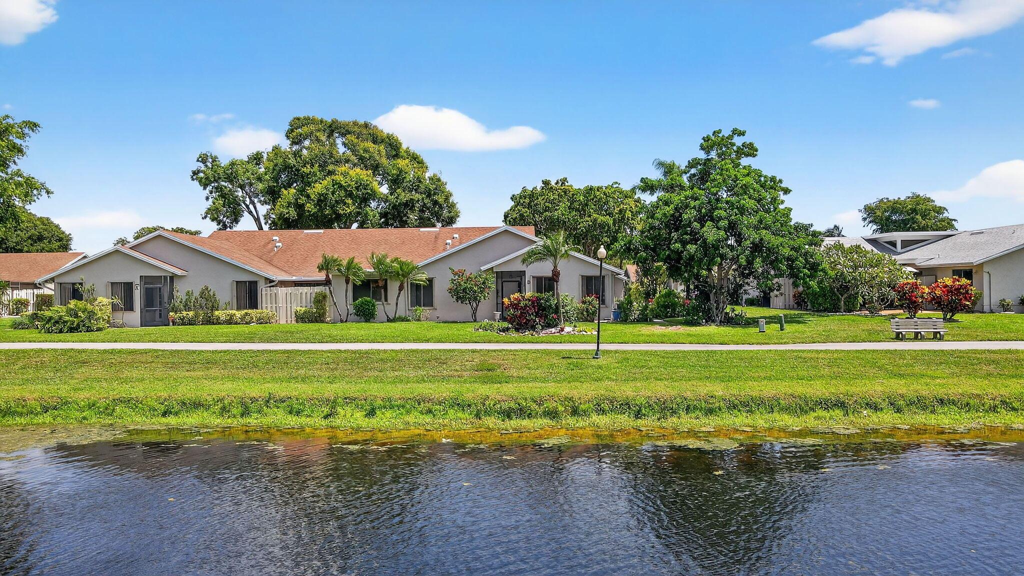 Beautifully situated on a tranquil LAKE, this spacious one-story, CORNER villa offers 2 bedrooms, 2 bathrooms, and a flexible den/home office. With over 1,600 sq. ft. of living space, the home is filled with natural LIGHT thanks to its desirable SOUTH-FACING exposure. Enjoy peaceful LAKE VIEWS from nearly every room. The OPEN-CONCEPT layout features a combined living, dining, and family area--ideal for entertaining. VAULTED CEILINGS create a bright, airy ambiance. The SPLIT FLOOR PLAN ensures privacy, and the enclosed Florida room offers a perfect space for a den, office, or additional lounge area. Located in the pet-friendly, man-gated community of Rainberry Bay, residents enjoy miles of scenic walking trails, many along beautiful lakes. Amenities include 5 heated pools, a theater, spa, tennis, pickleball, bocce courts, and a fitness center.
Just minutes from downtown Delray Beach, this villa offers a blend of comfort, convenience, and resort-style living&#x14;close to Atlantic Avenue's dining, shopping, and the area's stunning beaches.