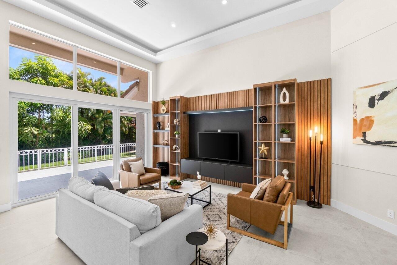 Stunning one-story townhome in the Windsor Parke section of The Polo Club. This property has been completely renovated, offering a rare opportunity for discerning buyers. Featuring 3 bedrooms, 3 full baths, and a 2 car garage.Every detail has been addressed, including brand-new impact windows, contemporary flooring, and updated LED lighting throughout. The open floor plan with volume ceilings is ideal for both comfortable living and elegant entertaining. A beautifully reimagined kitchen and spa-like bathrooms elevate the home's appeal, while the newly paved patio provides a perfect outdoor retreat with a private garden view.Mandatory Membership required. There is a 10 year roof assessment that started in 2019, which is $700/quarter.