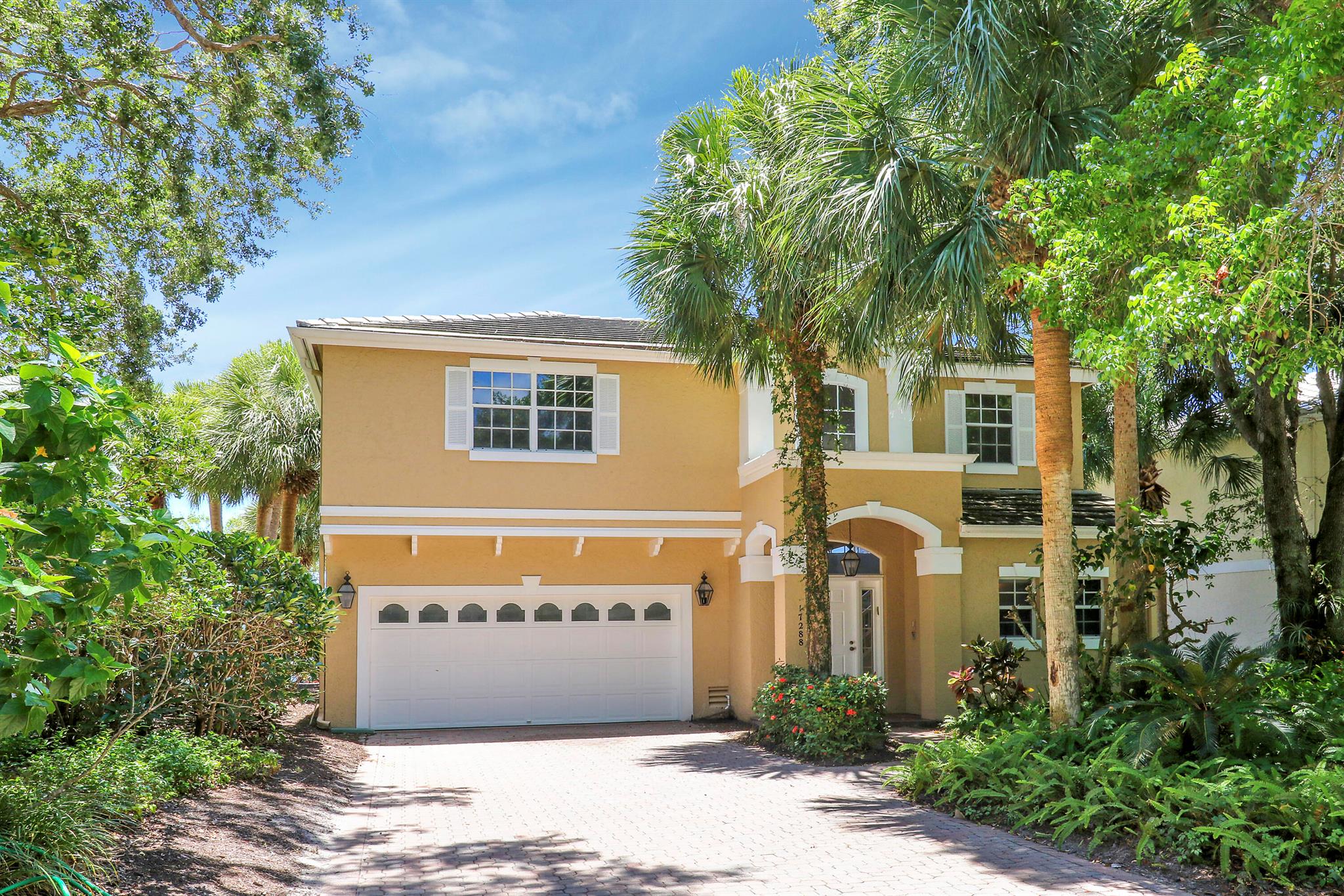 Don't miss this exceptional opportunity in the sought-after gated community of Jonathan's Landing--where country club living is available but not mandatory. This spacious 3-bedroom, 2.5-bathroom home offers peaceful lake and fountain views and has been freshly painted throughout for a clean, inviting feel. The spacious primary suite is conveniently located on the first floor and features a large en-suite bathroom and walk-in closet. Upstairs, a cozy loft area and two comfortable guest bedrooms   provide flexible living options for guests or a home office. The home includes two living areas and two dining spaces, enhanced by new skylights that flood the interior with natural light. Additional updates include the removal of all carpet and installation of luxury vinyl plank flooring, an extended paver driveway, and a screened-in patio&#x14;perfect for enjoying South Florida's outdoor lifestyle. A 2-car garage completes the package. Jonathan's Landing offers an unmatched array of amenities available to residents with a membership, including a state-of-the-art wellness center and spa, 10 Har-Tru tennis courts, 6 pickleball courts, 3 championship golf courses, a full calendar of social activities, and The Landing and Pub Restaurant. Residents without a membership still enjoy access to the community pool located in Bridgegate, bocce courts, a dog park, kayak racks, a playground and pavilion&#x14;all within a beautifully landscaped, secure community in the heart of Jupiter.