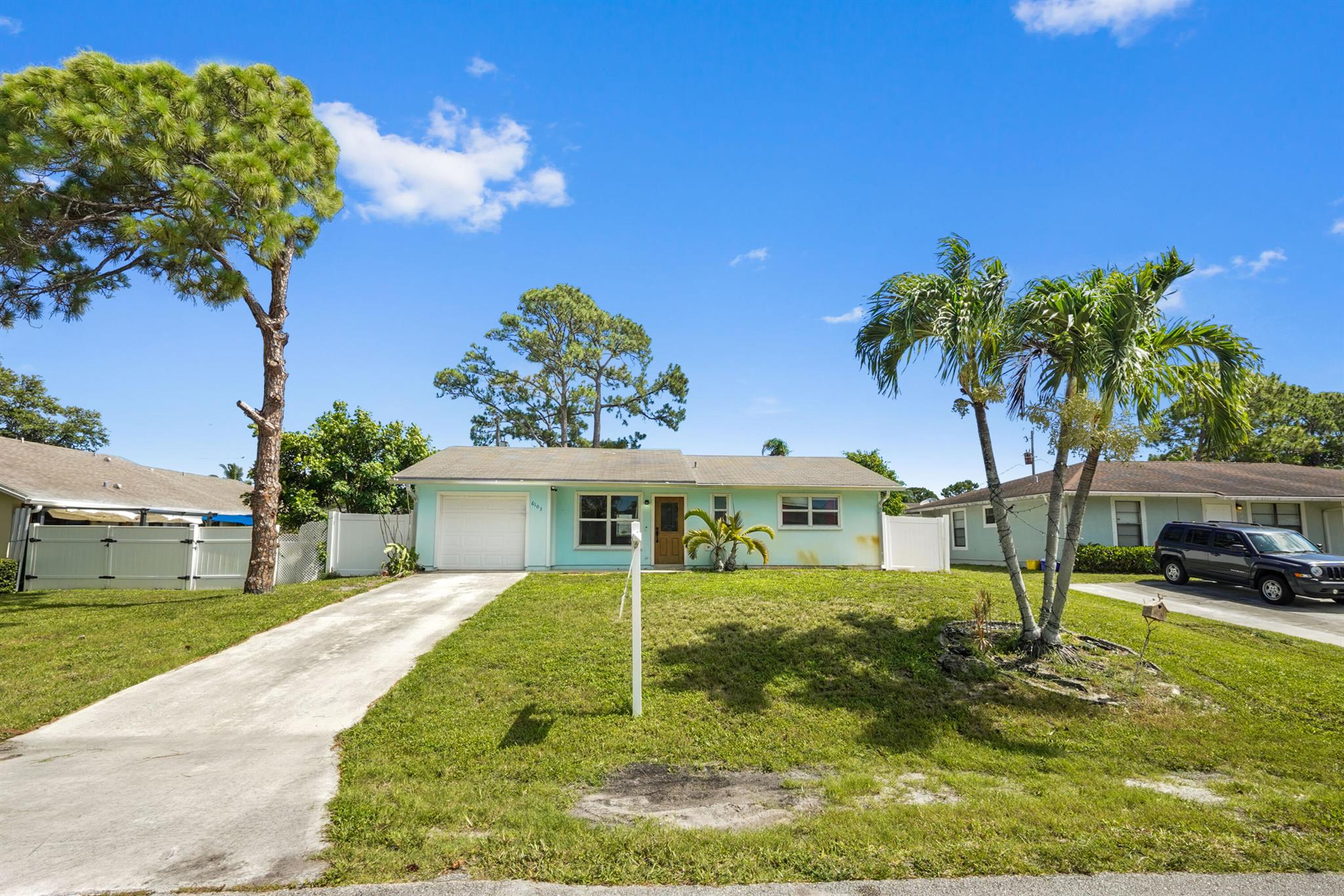 Discover your slice of paradise in this charming single-family home, nestled in the highly sought-after Jupiter Heights connected to Abacoa. This non-HOA community offers true freedom and flexibility, making it an ideal choice for those seeking a relaxed Florida lifestyle. Step inside and be greeted by a cathedral ceiling that enhances the open and airy feel of the living and dining areas. Enjoy peace of mind with hurricane impact windows and doors throughout the home. A sliding door provides seamless access to a spacious patio and fully fenced backyard. The galley-style kitchen, complete with sleek granite countertops, provides a functional and stylish space for all your culinary endeavors. The primary bedroom offers a private retreat, featuring a convenient ensuite bathroom for comfort and privacy. Enjoy the expansive back patio and fully fenced yard, perfect for outdoor entertaining, gardening, or simply unwinding in your own private oasis. An attached 1-car garage provides convenience and additional storage. Beyond your doorstep, this fantastic home is ideally located just minutes from Jupiter's renowned amenities, including fine shopping, diverse dining options, and the pristine beaches that make this area so desirable. Embrace the vibrant Jupiter lifestyle with easy access to everything you need and more!