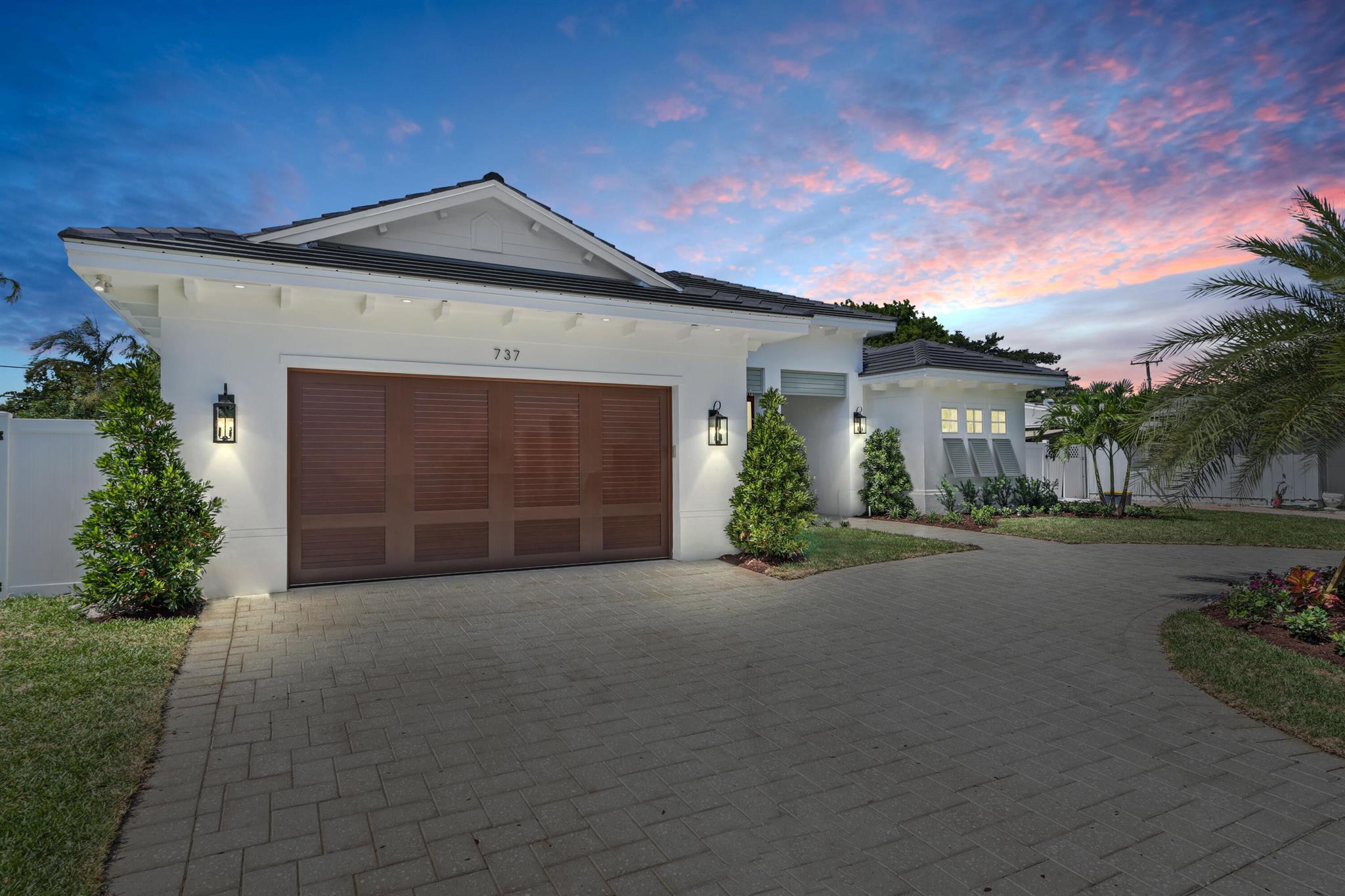 Introducing a 2025 Brand New Construction One-Story Pool Home in highly sought after North Palm Beach!! This new build sits on a 0.22-acre lot and features 4 bedrooms, 3 bathrooms, a study, and a 2-car garage offering 2,631 square feet of beautifully designed living space and 3,768 square feet total. Greeted by a covered front porch and welcoming entry lead to 10-foot-high double doors opening into the Foyer. The open-concept, split floor plan showcases Almond Porcelain Tile flooring throughout, 15-foot custom tray ceilings, cove lighting and a gourmet kitchen overlooking the great room and window-lined dining area. See supplement for additional information. The kitchen is equipped high-end Thermador appliances, custom paneling, an induction range with a designer hood, Natural Crystal Quartz countertops, soft-close shaker cabinetry, a built-in pot filler, chrome hardware, and designer pendant lighting. The spacious master suite spans across the East side of the home featuring 11-foot tray ceilings, timeless Marble Mosaic tile flooring, his-and-hers walk-in closets, 8-foot dual vanities with Natural Crystal Quartz countertops, a floating soaking tub, an oversized glass-enclosed shower with triple showerheads and marble walls, a Toto bidet toilet, and French doors that open to the patio with tranquil pool views. Enjoy year-round outdoor living in the backyard, complete with a beautiful salt-chlorinated Pool with a Sun shelf and Spa, a Summer Kitchen with built-in gas grill, 12-foot tongue-and-groove ceilings, cabana bath access, outdoor shower, lush landscaping, Natural Coral Stone pavers, and full privacy fence. From the moment you arrive, this home impresses with its landscaped, circular paved driveway, custom aluminum shutter panels, statement ease brackets, and sleek flat black tile roof. Additional features include epoxy garage with smart LiftMaster system, an Electrolux equipped laundry room with white Quartz counters, sink and custom cabinetry, spray foam insulation, and built-in closets in all guest bedrooms. Located just a short golf cart ride away from NPB Country Club, Lakeside Park, Anchorage Park + boat ramp, restaurants, Publix, and much more. 15 minute drive to Palm Beach International airport.
