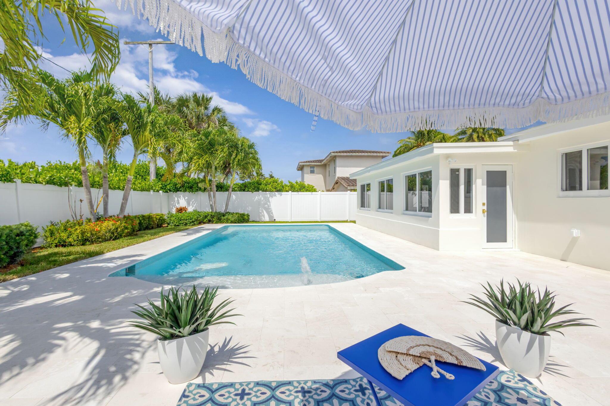 Welcome to your dream residence in the heart of prestigious North Palm Beach. This beautifully appointed single-story home blends timeless elegance with modern comfort, featuring 3 bedrooms, a den, 2 designer bathrooms, and a 2-car garage. The gourmet kitchen is a culinary masterpiece with quartz countertops and top-of-the-line appliances -- perfect for both casual dining and sophisticated entertaining. Step outside to your private backyard oasis, where a stunning pool invites you to bask in the Florida sun or host unforgettable gatherings. Ideally situated in a serene neighborhood, just moments from Lakeside Park, pristine beaches, the North Palm Beach Country Club, fine dining, and only 15 minutes from Palm Beach International Airport -- this is luxury coastal living at its finest
