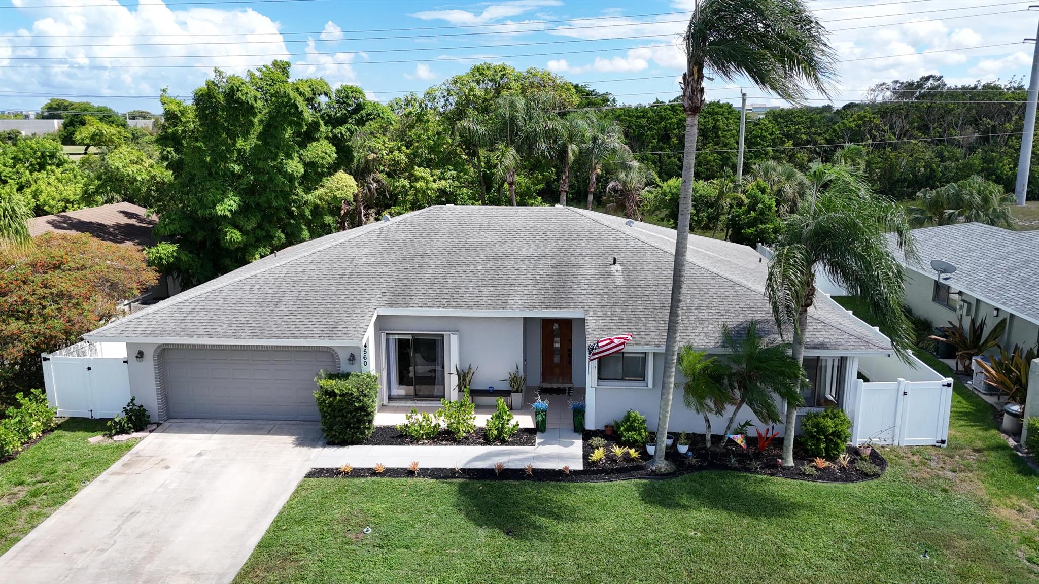 Beautifully updated 4-bed, 2-bath home with 2,000 sq ft in desirable Boca Raton. Marvel at the huge fully renovated kitchen with cabinets galore and large capacity side-by-side refrigerator and freezer.  Also enjoy both updated baths and floors, plus a modernized front exterior for great curb appeal. The added 4th bedroom, located off the laundry room, is ideal as an office, guest room, or den. Enjoy a spacious backyard with mango trees and no rear neighbors - perfect blank slate for a kids playset, pool, or even a she shed/man cave! New Bluetooth sprinkler system. Low HOA in sought after Pheasant Walk with kids play area and dock, located in an A-rated school district, close to shopping, dining, & with easy access to I-95 & the Turnpike. Move-in ready and just right to raise your family!