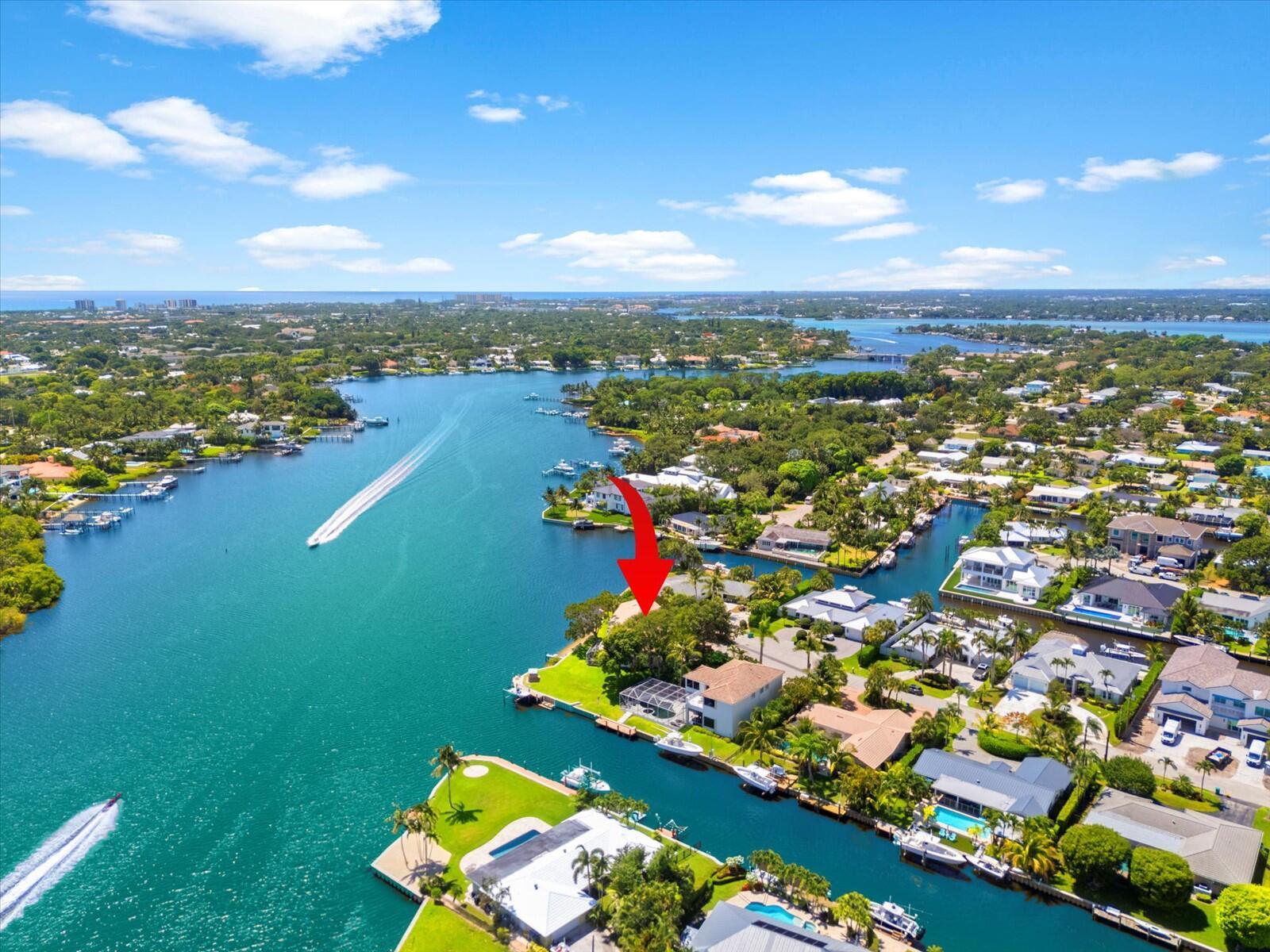 A rare and remarkable opportunity to renovate the existing home or build your dream home on one of Tequesta's most coveted waterfront lots. Situated on a .3-acre point lot at the end of a cul-de-sac, this property boasts approximately 211 feet of water frontage with long, unobstructed views of the Loxahatchee River and the tranquil Jackson Riverfront Pines Natural Area offering exceptional privacy and a truly picturesque setting.The vinyl seawall was replaced in 2016, making this the perfect canvas. Whether you're envisioning a sleek modern estate or a coastal retreat, the location and setting are second to none.You're just a short golf cart ride from Tequesta Country Club and Turtle Creek Club, and minutes from the area's top restaurants, A-rated schools, boutique shops, scenic