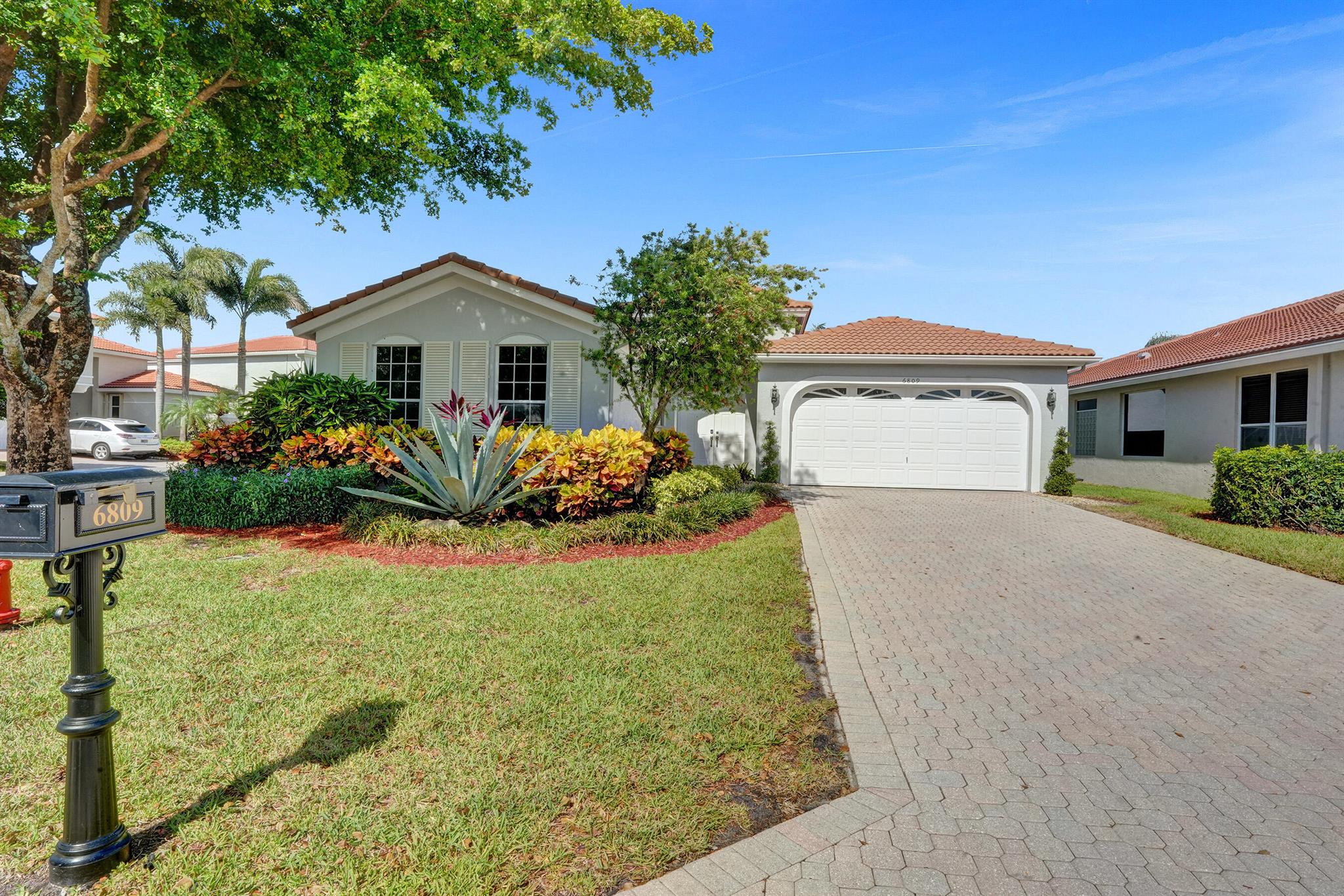 Stunning Lakefront Pool Home in Prestigious Newport Bay Club. Step into the Florida lifestyle with this light-drenched 3-bedroom + office , 3 bath lakefront retreat in the sought-after, amenity-rich Newport Bay Club.  Situated on a corner lot in a private cul-de-sac, this home boasts an expansive open-concept design and split floor plan, features soaring ceilings, freshly painted interiors and exterior, new plumbing, partial impact glass and full hurricane protection, kitchen island for gatherings and neutral-toned tile flooring that effortlessly complements any decor style.Enjoy serene sweeping lake views from your private screened-in pool and patio oasis, ideal for year-round outdoor living, entertaining such as fishing in your backyard or simply soak in the sunsets. Thoughtful upgrades include partial impact windows and a remote-controlled hurricane screen for added peace of mind. Just across the lake is "Millionaires Mile" in St. Andrews Country Club with multi-million dollar estates.

Resort-style living awaits: The HOA covers lawn care, cable, WiFi, exterior pest control, community painting, and 24/7 manned gate security. Residents indulge in world-class amenities, including a newly renovated fitness center, 7 lighted Har-Tru tennis courts, 4 pickleball courts, a basketball court, sauna, resort-style pool, playground, yoga classes, and a dynamic calendar of community events and social gatherings&#x14;all with no equity membership fees.

Perfectly located near the best of South Florida, you're just minutes from the beaches, Town Center Mall, Mizner Park, Downtown Boca Raton, and Delray Beach, and within walking distance to restaurants, shops, and coffee bars. Zoned for top-rated A+ schools, this home offers the ultimate combination of luxury, lifestyle, and location.

Move-in ready and available for immediate occupancy&#x14;come experience the very best of Boca living.