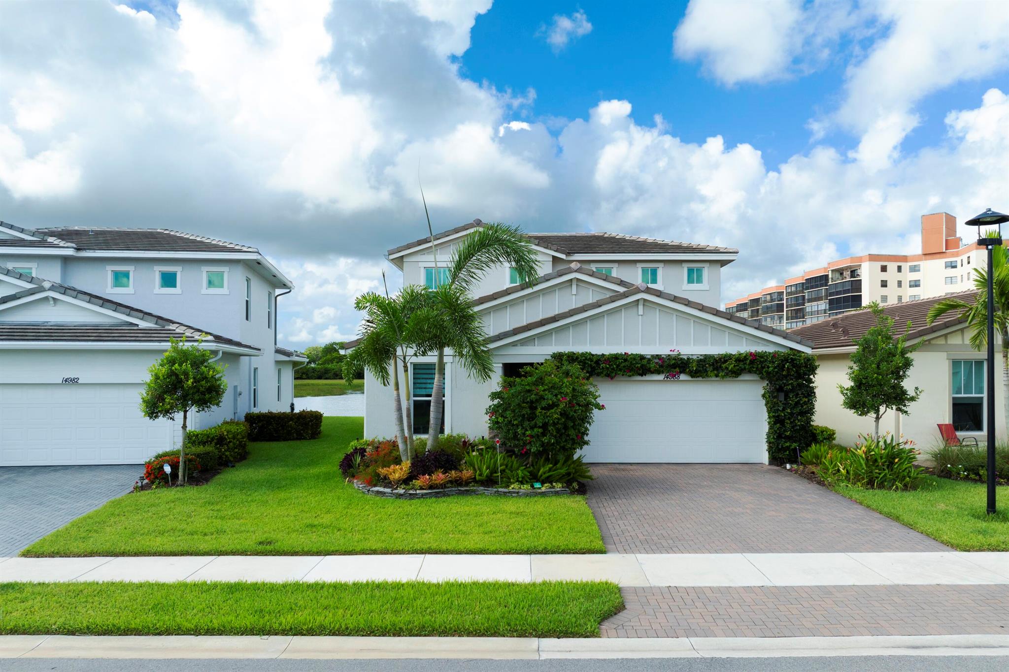 Stunning, move-in ready home with long lake views in the 55+ community of Avalon Trails in Delray Beach. Features include upgraded stainless-steel appliances with Cafe induction range, lighting, bathroom fixtures, marble kitchen & bathroom countertops with backsplashes.Brand-new driftwood grey plank flooring throughout, including 2nd floor media lounge. Enjoy an open-concept layout filled with natural light and $3,000+ in professional landscaping.Designed for comfort and style. Community amenities: clubhouse, fitness center, resort-style pool, pickleball, trails, and more. Minutes from downtown Delray, shopping, dining, and the beach.