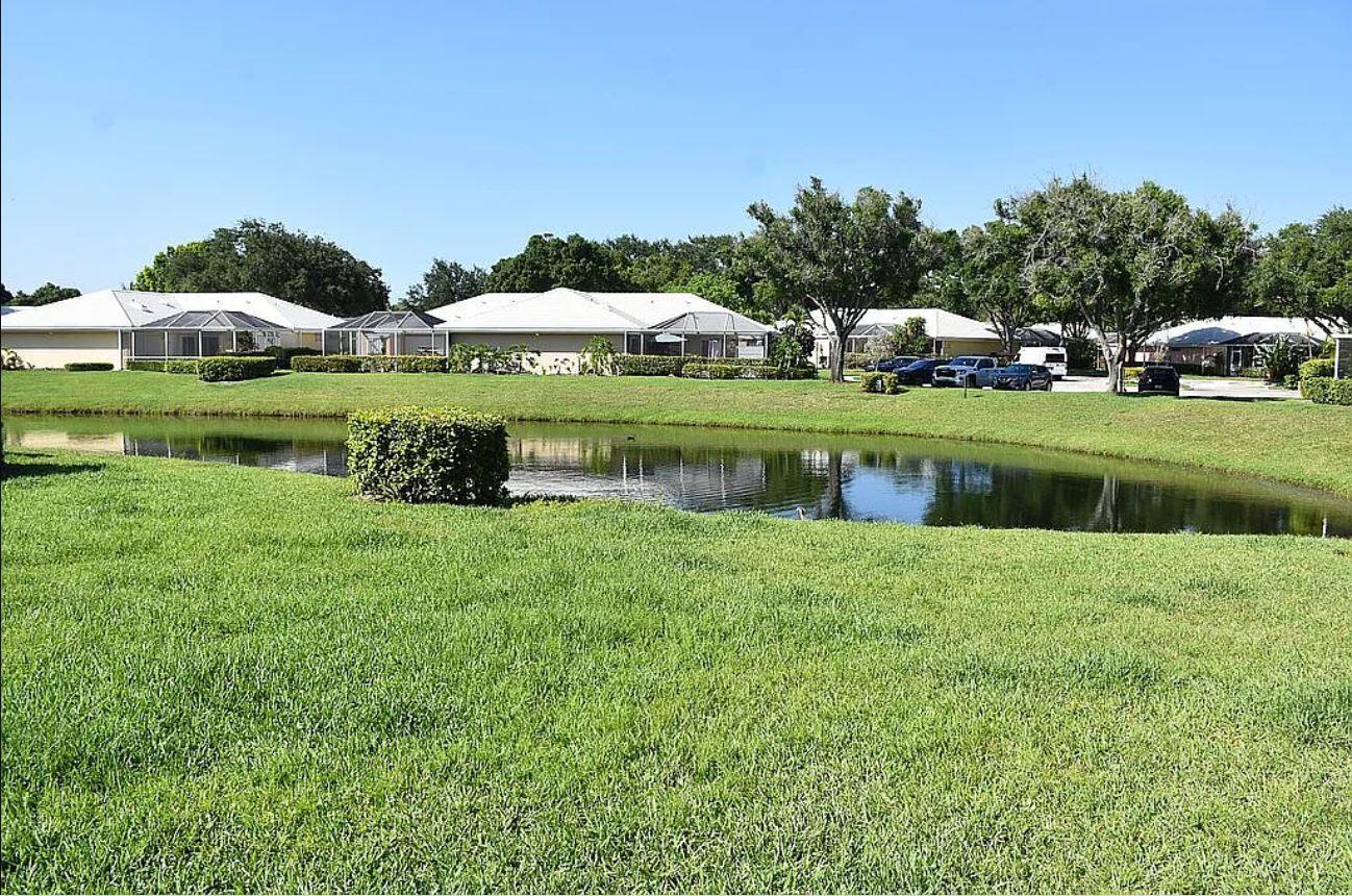 This beautifully remodeled townhome is one of the only properties currently available with a serene lake view, making it a rare and desirable find. The home has been thoughtfully upgraded throughout, offering a blend of comfort, functionality, and modern style. The A/C condenser was replaced in 2016, and the coil on the air handler has also been updated. Hurricane shutters are in place for peace of mind, and the front door features keyless entry for added convenience. The lanai floor has been freshly painted, and the sliding glass door has new hardware and wheels for smooth operation.Inside, the ceilings have been refinished with the removal of outdated popcorn texture, and elegant 51/4 in baseboards have been installed throughout. The master bathroom has been fully renovated ..... This beautifully remodeled townhome is one of the only properties currently available with a serene lake view, making it a rare and desirable find. The home has been thoughtfully upgraded throughout, offering a blend of comfort, functionality, and modern style. The A/C condenser was replaced in 2016, and the coil on the air handler has also been updated. Hurricane shutters are in place for peace of mind, and the front door features keyless entry for added convenience. The lanai floor has been freshly painted, and the sliding glass door has new hardware and wheels for smooth operation.

Inside, the ceilings have been refinished with the removal of outdated popcorn texture, and elegant 5-+-inch baseboards have been installed throughout. The master bathroom has been fully renovated with high-end finishes, offering a spa-like retreat. The spacious great room boasts original oak hardwood flooring and a custom built-in unit that spans an entire wall, providing both charm and functionality. The kitchen has also been beautifully renovated, and a brand new hot water heater adds to the home's efficiency and value.

This turnkey townhome is a perfect blend of quality upgrades and tranquil lakefront living.