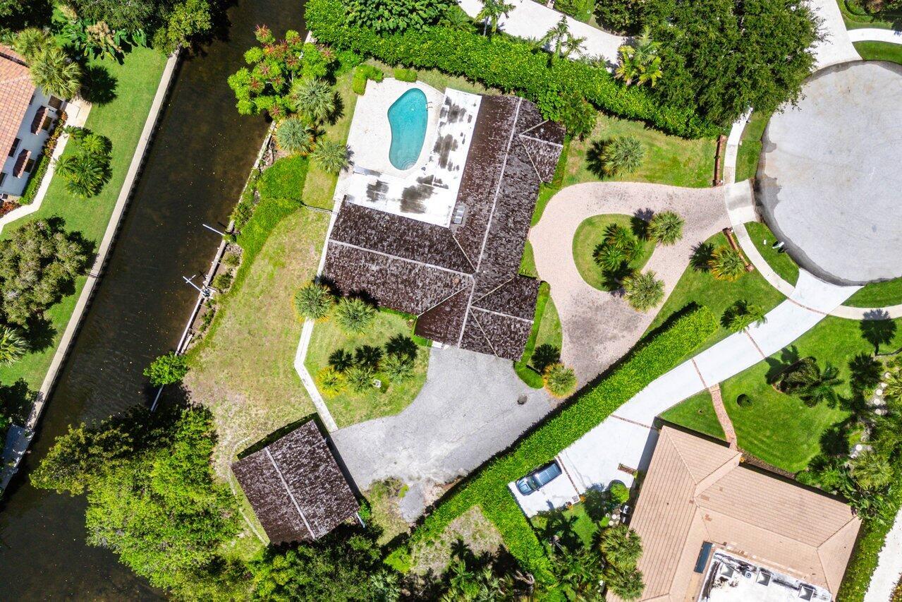 ONCE-IN-A-LIFETIME WATERFRONT OPPORTUNITY - OVER 280 FEET OF FRONTAGE IN HIDDEN KEY! Located at the end of a private cul-de-sac in the prestigious gated community of Hidden Key, this expansive property offers more than 280 feet of waterfront and backs to the exclusive enclave of Captain's Landing--providing unmatched privacy and scale. The lot currently features a 3-bedroom, 3-bath, 2car garage, pool home with formal living and dining rooms, a large family room, and a partially surrounding screened patio for indoor-outdoor living. While the existing structure offers a spacious footprint, it is best suited for a complete renovation or teardown, giving the next owner the chance to build a spectacular custom estate in one of North Palm Beach's most sought-after waterfront communities..... A massive detached 4-car garage with workshop is ideal for car collectors, hobbyists, or storage. Enjoy direct access to the too Little Lake Worth 1 lot away. Easy access to the intracoastal perfect for boating &amp; fishing, paddleboarding, kayaking, jet skis . Hidden Key offers gated entry, quiet streets, and an unbeatable location near world-class golf, dining, beaches, and shopping. This is a rare chance to create a legacy property in a prime waterfront location.