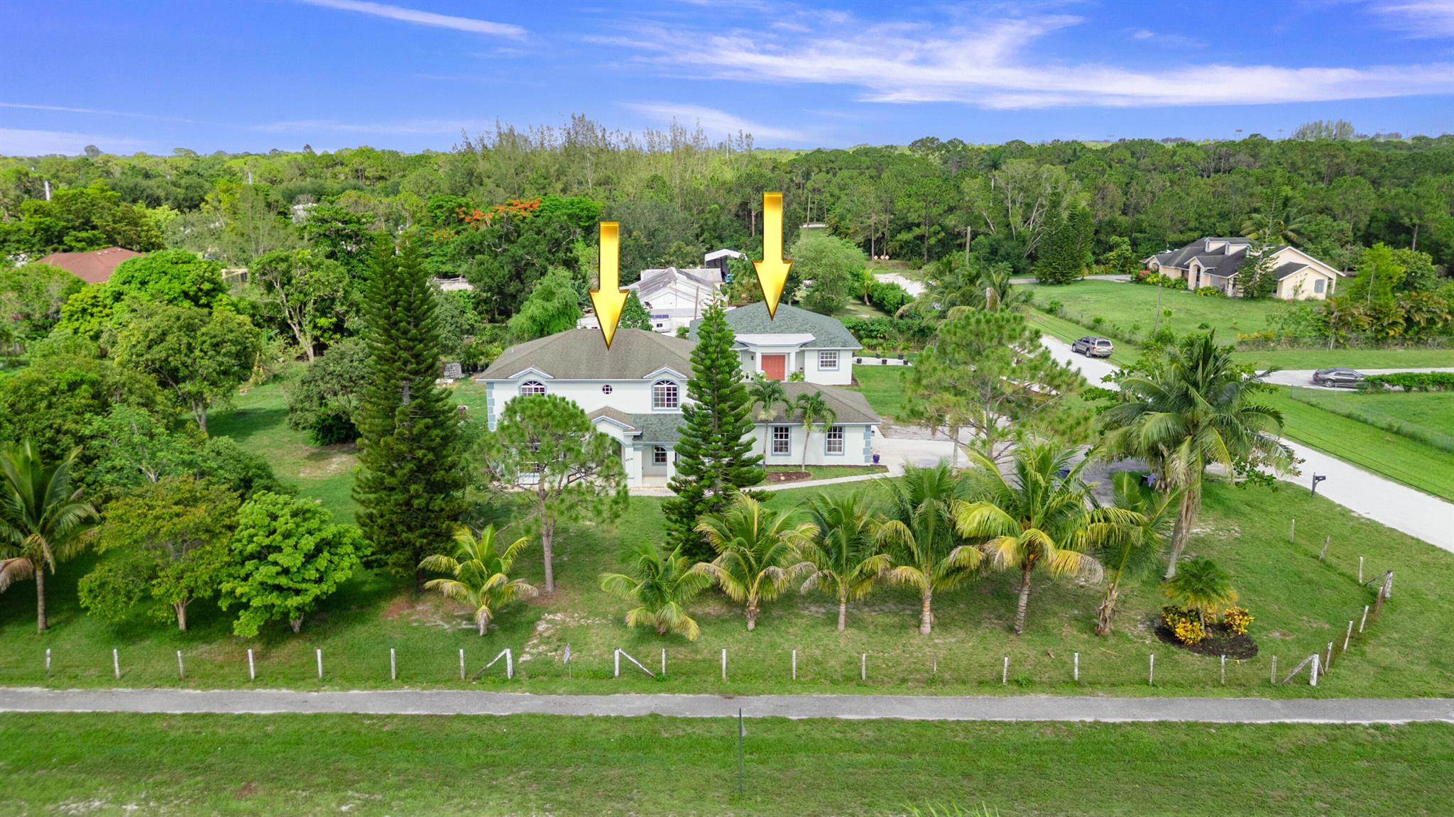 Two Homes on 1.34 Acres - Multi-Generational or Income Opportunity!Discover this rare gem featuring two separate homes on a sprawling 1.34-acre lot, offering a total of 6 bedrooms, 5.5 bathrooms, and nearly 4,500 sq ft under air. Perfect for multi-generational living or as an income-producing investment, this property provides space, privacy, and flexibility.The main house boasts 4 bedrooms and 3 full bathrooms, including a downstairs bedroom and a full bath. Enjoy the charm of a vaulted foyer entry with ceramic tile, leading to a formal dining room, media room with wood floors, and a bright Florida room with updated wood flooring. The remodeled kitchen features energy-efficient appliances, a breakfast nook, and modern finishes. A computer/flex room, bay windows, and almost all new electric fixtures add functionality and comfort. The home recently passed both a 4-point inspection and wind mitigation, and includes a 2.5-year-old A/C system with dual 3-ton units, plus a 2-year-old water heater and water system. Hurricane protection includes complete shutters or impact windows for peace of mind. Total electric bills for both homes stay under $400!

The guest house, just 1 year old, offers a private retreat or income potential with its separate driveway, tile floors throughout, pocket doors, and private entrance. Built with safety and efficiency in mind, it features full hurricane impact windows and doors, providing superior storm protection and energy savings.

Outside, the lush property is a tropical paradise with an impressive variety of fruit trees. Enjoy fresh harvests of coconuts, avocado, star apple, June plum, sapodilla, guinep, mangoes, lychee, coolie plum, banana, tamarind, jackfruit, and pomerac&#x14;right from your backyard. Whether you're a gardening enthusiast or simply love fresh fruit, this vibrant orchard adds natural beauty and edible abundance to your lifestyle. 

A unique opportunity to own two move-in ready homes in one, with top-notch upgrades, energy efficiency, and room to grow. Schedule your private showing today!