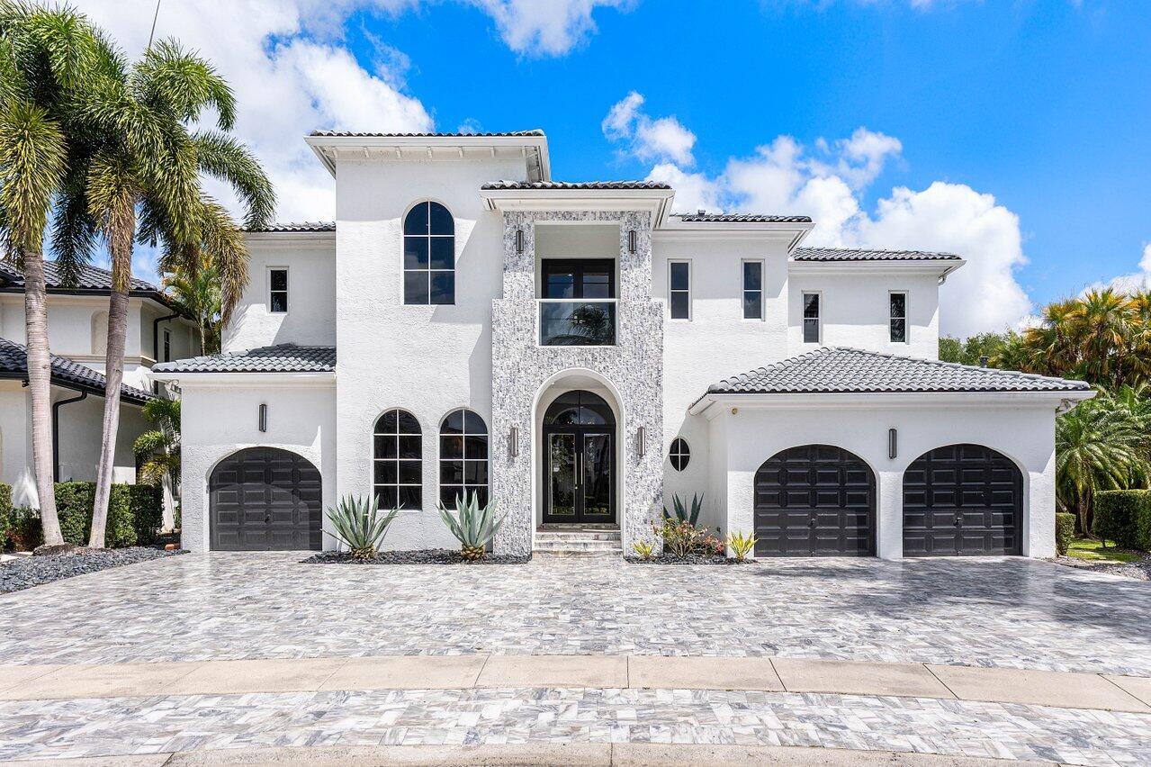 Welcome to 17729 Middlebrook Way: a contemporary estate tucked at the end of a quiet cul-de-sac in The Oaks, offering unmatched privacy and resort-style living. This designer home sits on one of the largest lots in the community, featuring an Italian marble driveway, a modern facade, indoor and outdoor basketball court and a three-car garage. Inside, soaring ceilings and porcelain floors lead you through elegant living spaces filled with natural light and panoramic views of the custom marble patio, heated pool, spa, and private basketball court. Entertain in style in a sleek remodeled kitchen, formal dining room, private billiards room, and expansive family room. This home has it all! The Oaks offers unmatched resort style living with full service spa, restaurant, tennis & more!