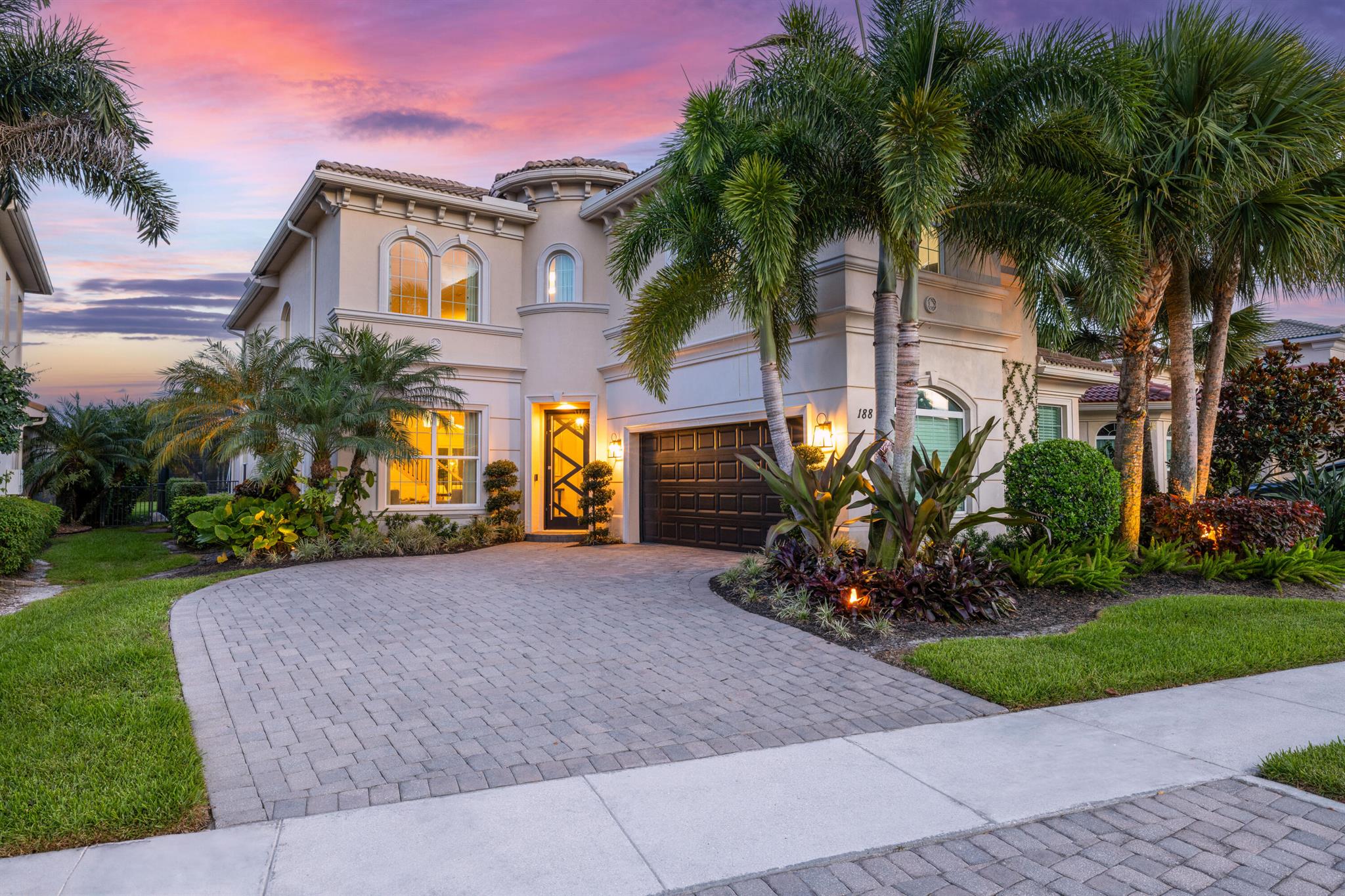 Welcome to 188 Carina Drive, a beautifully updated and meticulously maintained residence located in the prestigious Jupiter Country Club. This stunning home offers 3,598 square feet of thoughtfully designed living space, featuring 4 bedrooms, a versatile loft, and an office or den that can serve as a fifth bedroom.The main level showcases elegant marble flooring and includes the spacious primary suite on the first floor, offering privacy and convenience. All additional bedrooms, along with the loft and office/den, are located upstairs, providing the perfect layout for families, guests, or working from home. The loft makes an ideal space for recreation, a media room, or a second home office. A gourmet kitchen with luxurious finishes and new appliances opens to the main living areas, making it perfect for both everyday living and entertaining. The home also includes a new water heater, offering added peace of mind.

Step outside to your own private backyard oasis, where lush landscaping surrounds a sparkling heated pool enclosed by a screened-in lanai, adding extra comfort and year-round enjoyment. You'll also enjoy a large yard with beautiful green space and a well-appointed outdoor entertaining area&#x14;perfect for relaxing or hosting guests. The home is perfectly located within the community, offering privacy while being just a short distance from the clubhouse and amenities.

This home includes a highly sought-after golf membership and grants access to the exclusive amenities of Jupiter Country Club, including a newly renovated clubhouse, a Greg Norman-designed 18-hole golf course, two resort-style pools, a state-of-the-art fitness center and spa, as well as courts for pickleball, tennis, and bocce. Enjoy fine and casual on-site dining, a vibrant social calendar, and a welcoming, active lifestyle.

Located just minutes from beautiful beaches, top-rated schools, and upscale shopping and dining, 188 Carina Drive offers the ultimate blend of luxury, comfort, and South Florida charm.

Don't miss your chance to own this exceptional home in one of Jupiter's most desirable communities.