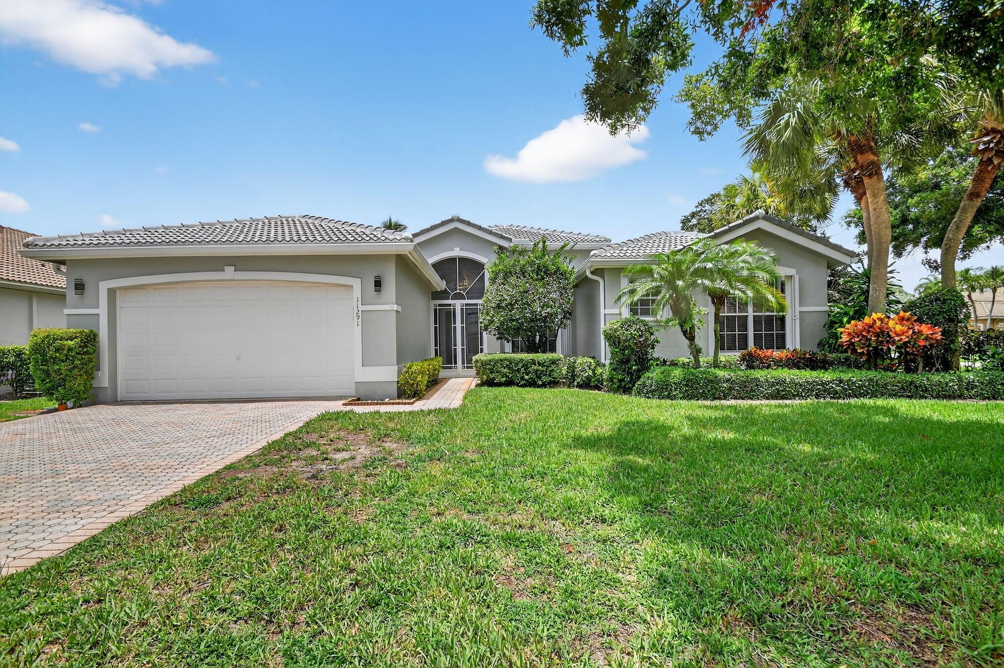 This home is Priced to sell Quickly! Stunning Rare Maderia, Crown Series, Open Floor Plan is perfectly situated on a Private Premium Huge Corner lot .23 Acre w/lots of room between homes & room for a pool. Lake views from Patio & Many Rooms in home. Re-roof 2024, Solar-Photovoltaic installed 2019, seller claims Very Low electric bills average $50 month & is fully Equipped w/Accordion Shutters 2021. True 3 Bedroom with closet & doors in all 3 rooms. Upgrades Galore including custom closets! New Clubhouse opened recently. Don't miss this one. Won't last long! Enter this lovely home though a Grand Double door entry with covered Birdcage screen. Gourmet kitchen complete with 42" cabinets, granite counters, new few month new LG refrigerator, Stainless Steel Appliances &amp; Oversized pantry. Bathroom two was upgraded beautifully with walk in shower, tile to ceiling w/listello inserts, new tile floor, upgraded lighting, frameless shower doors, undermount sinks &amp; the works. Seller has removable bidet in toilet. Large Primary bedroom is very comfortable. Custom niche in hallway. Large laundry room. Seller will leave extra refrigerator in laundry room for buyer. Upgrades galore include custom fitted closets w/built-in safe, Hunter Douglas silhouette blinds, all window coverings, designer fans &amp; fixtures throughout w/lots of high-hats. No carpet in this home. Outdoor patio &amp; screen was extended with upgraded concrete floor. Upgraded security system includes motion detectors &amp; guard gated gates. Come live the country club lifestyle without paying country club fees. You will enjoy the fabulous updated clubhouse. Enjoy Ruven's Cafe, USTA Tennis, Large main &amp; lap pool, Pickleball League, Water Aerobics, Fitness room, theater &amp; so much more. There is something for everyone including Bowling, golf, bike clubs &amp; the works. Come live the dream. Close to shopping, grocery, malls, restaurants &amp; Interstate &amp; Turnpike.