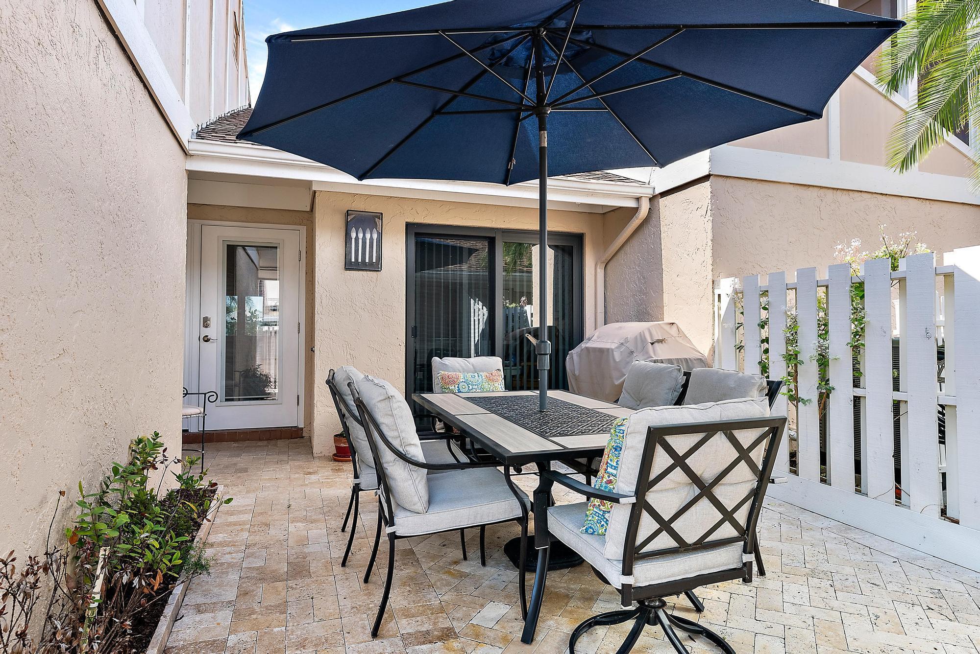 Nestled within the prestigious and sought-after Jonathan's Landing community, this rarely available single-story townhome presents a unique opportunity to embrace a lifestyle of comfort, tranquility, and refined living. Featuring three well-appointed bedrooms, the home offers an ideal layout for both relaxation and entertaining, all set against the backdrop of serene lake views that add a calming, picturesque ambiance to everyday life.Crafted with attention to both style and functionality, this residence is equipped with full impact windows and doors, providing not only enhanced security but also invaluable peace of mind during Florida's storm season. A newly installed air conditioning unit ensures a cool and comfortable environment year-round, adding to the effortless livability of the space.

The expansive floor plan is thoughtfully designed to maximize natural light and flow, creating a seamless connection between indoor and outdoor living areas. Whether enjoying a quiet morning on the patio or hosting guests in the spacious living and dining areas, this home adapts beautifully to a variety of lifestyles. Ample outdoor space offers room to relax, garden, or entertain, all while enjoying the low-maintenance advantages that townhome living affords.

Located within Cape Pointe, one of the most desirable neighborhoods, residents have access to a large community pool, and they allow large dogs. Jonathan's Landing itself is a private, gated golfing community ideally situated along the Intracoastal Waterway, offering a serene and secure environment. While golf, sport, and social memberships are available, they are entirely optional.

Adding to its appeal, this home is within walking distance of shopping centers, a variety of restaurants, and grocery stores, placing everyday conveniences right at your doorstep. With its combination of prime location, solid construction, and community perks, this townhome is a rare gem&#x14;an exceptional opportunity for the discerning buyer seeking comfort, security, and an elevated lifestyle in one of South Florida's most desirable settings.