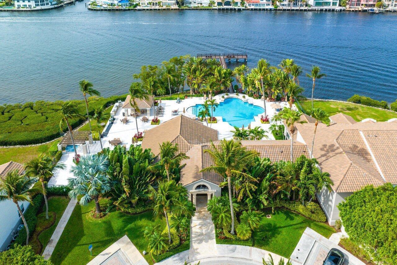 Live the coastal lifestyle in this spacious 2BR/2BA condo located in Highland Beach's premier waterfront community. Featuring a split floor plan, impact windows/doors, marble floors, and a freshly painted interior, this unit is move-in ready--unfurnished or turnkey. The large updated kitchen boasts white quartz counters, stainless appliances, and a snack bar open to the living area. Enjoy the convenience of a full-size laundry room/pantry, Nest thermostat, custom closet systems, and a dedicated wine fridge for your favorite vintages. Catch a charming ''peek-a-blue'' of the ocean--just enough to remind you it's there without requiring SPF. A/C and hot water heater are newer. Upscale, serene, and steps from the sand. No rental waiting period makes this a great investment.2 pets OK, all age.. or unfurnished. The Highland Beach Club is a true paradise for beach lovers with tropical and resort like pool on the intracoastal, BBQ's, outdoor TV, pizza oven, outdoor dining area, hot tub, pedestrian dock on the intracoastal, gym, sauna, steam room, club house, billiard room, business center and a tennis/pickeball court....every amenity you could want! Private beach is directly across the street. Investor and pet friendly! This is 24 hour man gated community located minutes from the fabulous restaurants, shops, movies, fairs, concerts and cultural events in Downtown Delray and Boca's Mizner Park.