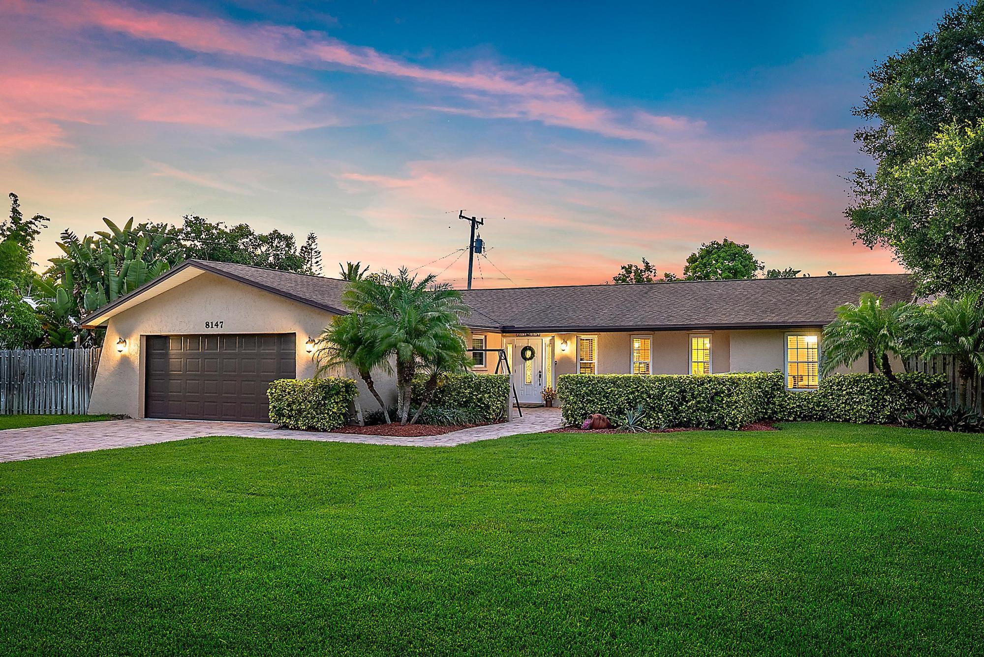 WELCOME to your slice of coastal paradise in the highly desirable, non-HOA community of North Hobe Sound Shores! This beautifully cared-for 3-bedroom, 2-bathroom single-family home offers over 1,700 square feet of comfortable living space, nestled on an oversized lot of more than one-third of an acre. With a spacious split floorplan, a 2-car garage, 2016 roof, 2021 A/C, and a huge backyard with room for a pool, this home has everything you've been dreaming of and more. Best of all, there are absolutely no rental, boat, or RV restrictions, making it the ultimate freedom-lovers retreat just minutes from the beach, grocery stores, shops, and US-1!Step inside and be greeted by a warm and welcoming layout that immediately feels like home. To your right, a bright formal living room invites you to unwind or entertain, flowing effortlessly into a dedicated dining area - perfect for hosting dinner parties or holiday gatherings. Just off this wing of the home, the spacious primary suite creates a private sanctuary with a walk-in closet, dual-sink vanity, and walk-in shower.
Back toward the heart of the home, you'll find a cozy yet open family room that connects seamlessly to the kitchen. This second living area is ideal for everyday lounging or movie nights and features French doors that open to your enclosed patio. The kitchen itself is a chef's delight, offering stainless steel appliances, tons of storage, ample pantry space, and a layout that keeps you connected to the rest of the home while you cook.
On the opposite side of the house, two generously sized guest bedrooms share a beautifully updated bathroom with a double vanity and a tub/shower combo - perfect for visitors, family, or a home office setup.
Through the family room, step into your enclosed and air-conditioned patio - a true bonus space that can be enjoyed year-round. Whether you're sipping your morning coffee with the doors wide open or using it as a sunroom or play area, this space adds flexibility and function. Outside, the backyard is truly a dream: fully fenced, sprawling with lush potential, and more than enough room to add a custom pool, a garden, or space to park your toys.
Additional features include a split floor plan for added privacy, panel shutters for storm protection, and no HOA, giving you total control over how you live, rent, and enjoy your property.
North Hobe Sound Shores is a quiet, tucked-away gem with a true neighborhood feel and a laid-back coastal charm. Enjoy all the perks of a well-kept community without any of the restrictions.
Situated in the heart of Hobe Sound, this home is just minutes to pristine beaches, top-rated schools, scenic parks, charming local restaurants, and convenient access to US-1 for an easy commute north or south.
Opportunities like this don't come around often, schedule your private showing today and make this Hobe Sound treasure yours before it's gone!