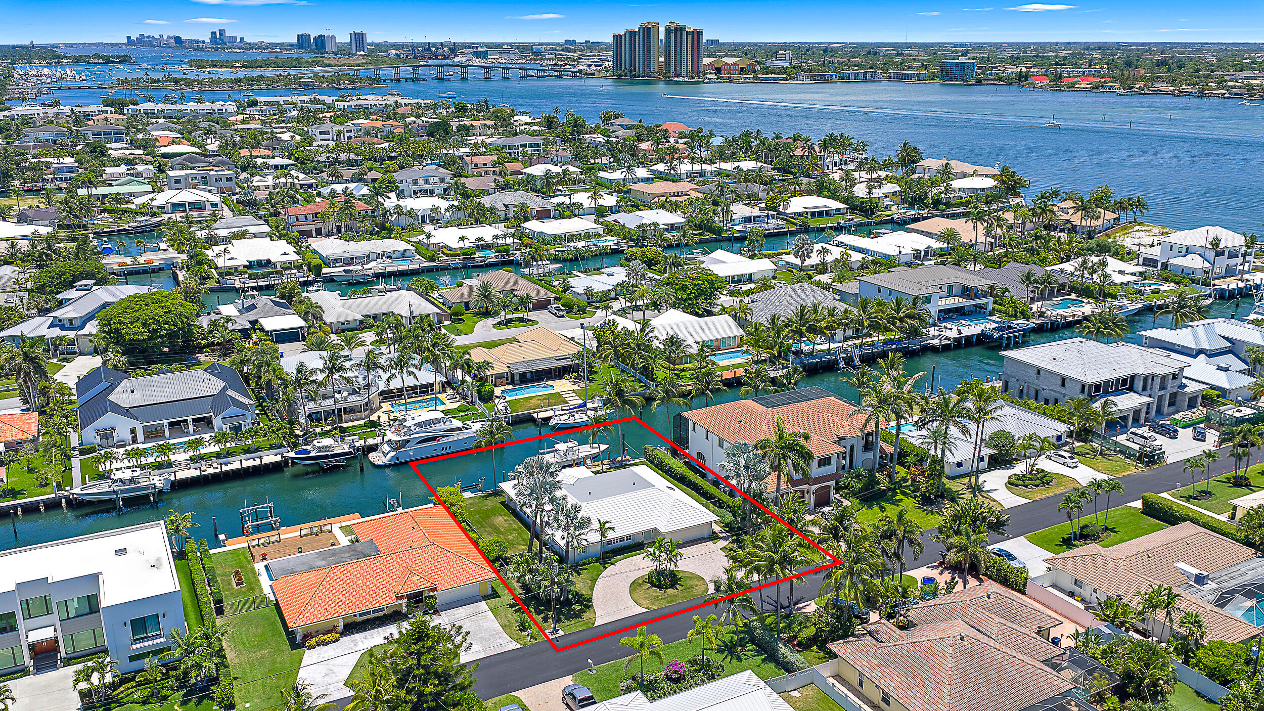 Just minutes from the Palm Beach Inlet this Palm Beach Isles home offers 100' of deepwater frontage, a 65' dock with two boat lifts: 24,000lbs & 10,000lbs. This home offers an updated kitchen with stainless appliances, updated bathrooms, new roof and impact windows 2023 and a 16KW Generac generator.