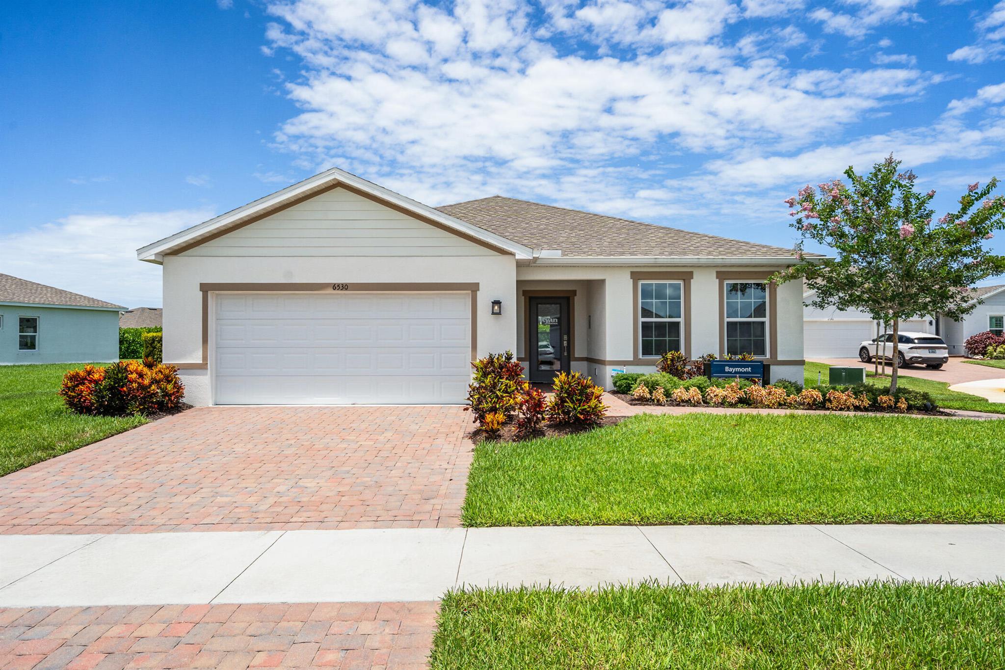 Experience the effortless elegance of the Baymont model--a former showcase home by Ryan Homes-- never lived in perfectly positioned in the sought-after Lost Tree community in beautiful Vero Beach .This meticulously maintained residence blends timeless coastal architecture with modern interior finishes, offering a spacious open-concept floor plan, ideal for both everyday living and effortless entertaining. The heart of the home is a chef-inspired kitchen featuring granite countertops, a large center island, upgraded cabinetry, and stainless steel appliances--all opening to the great room and abundant natural light. The owner's suite is a true retreat, complete with a walk-in closets and a spa-style bathroom with a walk-in shower and dual vanities. on a oversize lot, best rated schools