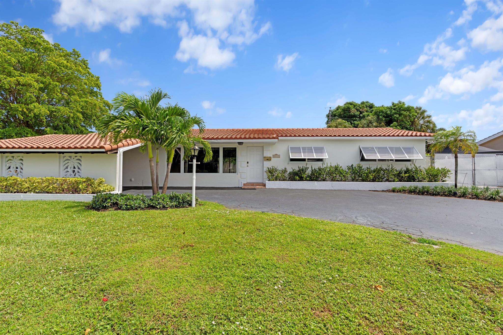 Live Where Others Vacation - North Palm Beach Corner Lot Beauty! Step into timeless elegance blended with modern luxury in this meticulously updated North Palm Beach gem! Originally built in 1958, this residence underwent a complete, high-end renovation--making it move-in ready with all the comforts of today's lifestyle.From the moment you enter, you'll notice the warmth of Mohawk engineered oak wood flooring leading you through the open-concept living space. The gourmet kitchen is a true showpiece--featuring premium Quartz countertops, Dolomite marble backsplash, soft-close cabinetry, and a sleek induction range with built-in air-fry technology.  Whether you're hosting dinner parties or a quiet evening in, this kitchen is built to impress. ( Cont'd )