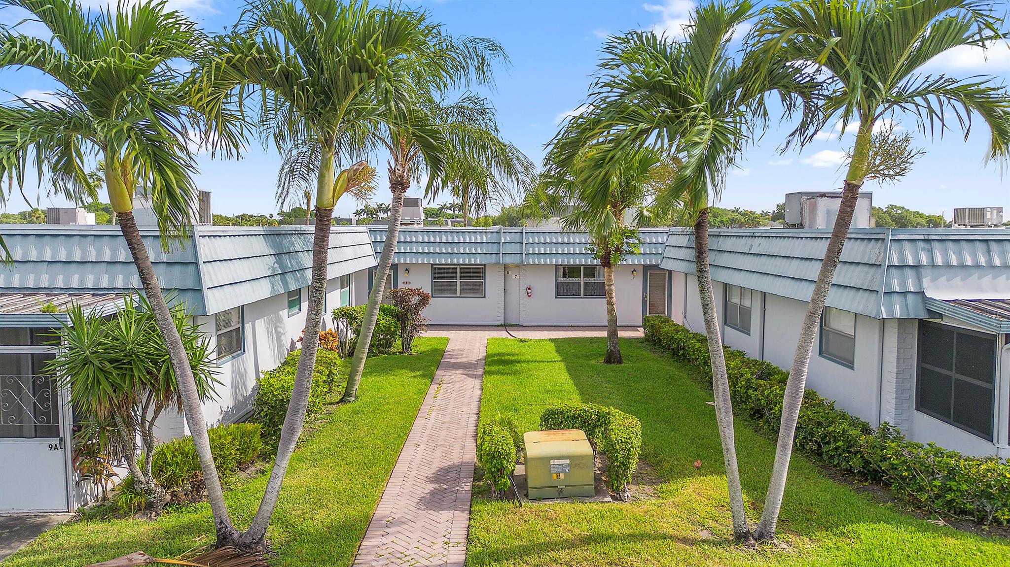 Welcome to 8 Waterford A, a beautifully updated 2-bedroom, 2-bath waterfront condo in the highly desirable 55+ King's Point Golf and Country Club. Ideally located just steps from the clubhouse, this home offers both comfort and convenience. It features all-ceramic tile flooring, walk-in showers in both bathrooms, and sliding glass doors in each bedroom that open to a fully enclosed patio with its own A/C unit--perfect for enjoying the stunning water view overlooking the clubhouse. The kitchen is equipped with soft-close cabinets and granite countertops, with no detail overlooked. Additional upgrades include a tankless water heater, a 2-year-old A/C unit, and a General Electric electrical panel.