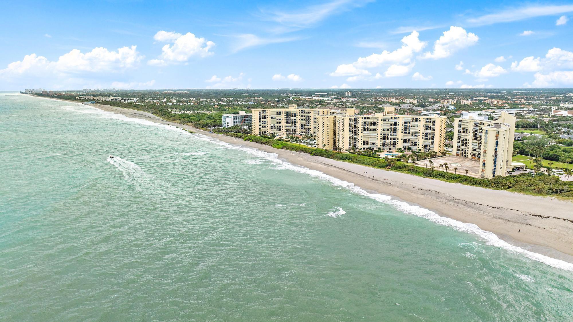 With The Most Amazing Water Views & Amenities of a Luxury Community; This Absolutely Stunning 2 Bedroom, 2 Bathroom Condo On The Beach Sits In The Heart Of Jupiter. Offering 1270 Lvng Sq Ft This Ocean Front Condo Has Been Updated; Upgrades Include: Granite Countertops, Stainless Steel Appliances, Beautiful Subway Tile Backsplash. The Master Bedroom Has Direct OCEAN FRONT VIEWS with an Updated Master Vanity & Spacious Stand Up Shower. The Master Bedroom Includes A Large Walk In Closet W/ Closet Organizers. The 2nd Bedroom Has a Large Closet , Convenient Washer &amp; Dryer Inside, a Large Balcony Overlooking The Pool &amp; Dramatic Blue Horizon. This Condo Is Gated &amp; Has 24 Hour Security,  - CURRENTLY UNDER CONSTRUCTION -  2 Heated Pools, Hot Tubs, Sauna, Grill Stations, Outdoor Showers, Fitness Center, Tennis Courts, Green Spaces, Pond, Trails &amp; Private Beach Paths. A Golf Cart Shuttle Will Whisk You To Local Restaurants, Shops, Theatres, Marinas, Mini Golf &amp; Tee Time. Stunning is an Understatement For The Rarest Gem in Ocean Trail.