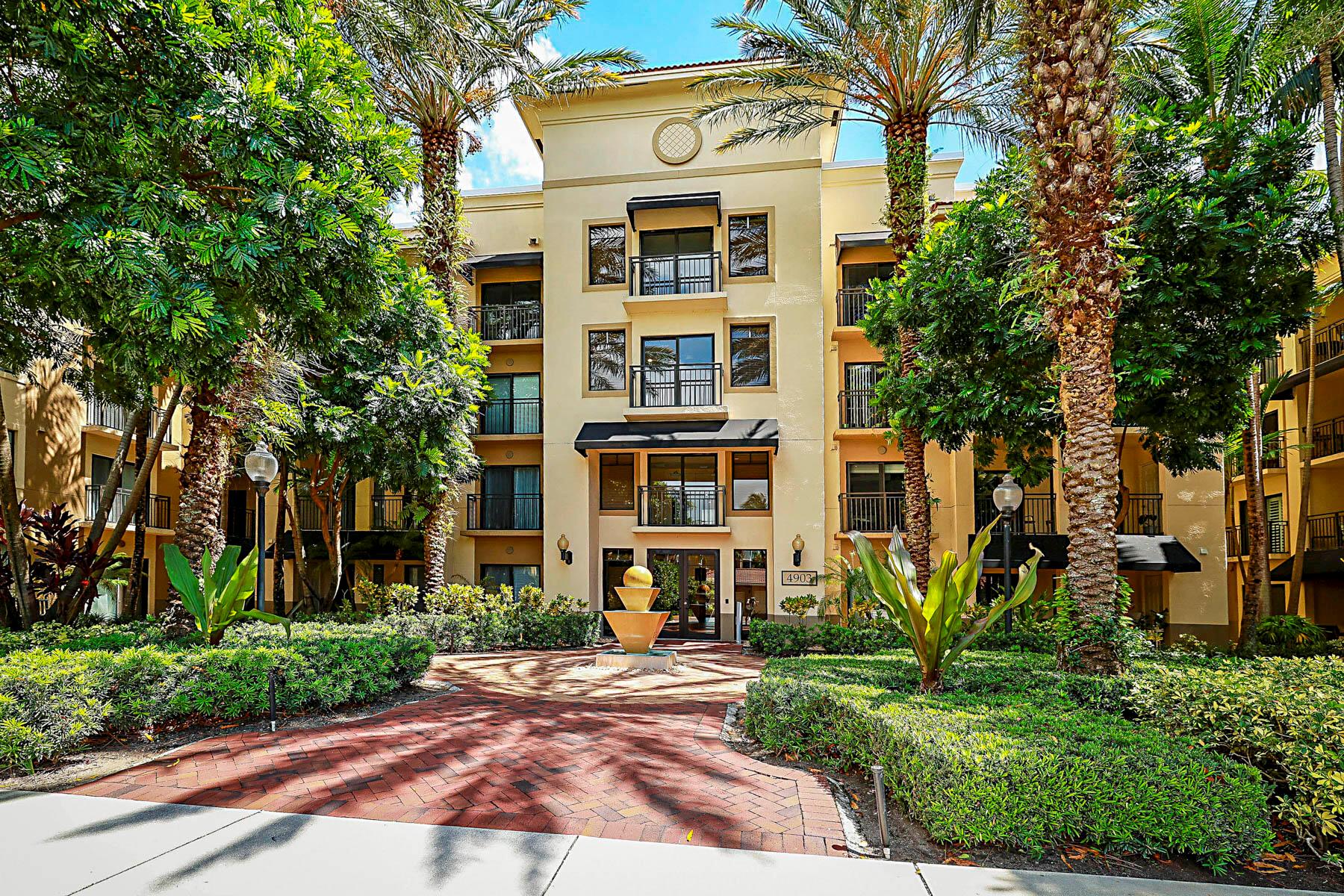 UPDATED AND 100% MOVE-IN READY WITH 1 CAR GARAGE!!!   This 2 bedroom, 2 bath condo is Meticulous with the beautiful white kitchen cabinets, stainless appliances, and granite countertops.  The kitchen is wide open to the living room with a snack bar, dining area, crown moldings, all tile and gorgeous blonde laminate flooring throughout, NO CARPET!  The master suite offers a spacious bedroom & bathroom with dual vanity sink, walk-in shower, separate tub, linen closet, walk in closet, and gorgeous views of the courtyard.  The guest bedroom has a private door out to the balcony, perfect for a quiet morning coffee.  This unit also comes with a 1 CAR GARAGE!  AC 2022, kitchen update 2023, HWH 2023, Fridge and Dishwasher 2021, Impact windows, ..... laundry room has great amount of shelving for storage.  Community offers a full gym, library, community room, resort style pool, hot tub, tennis, and pickle ball.  Walk out to shops and a multitude of restaurants.  This is a prime location.