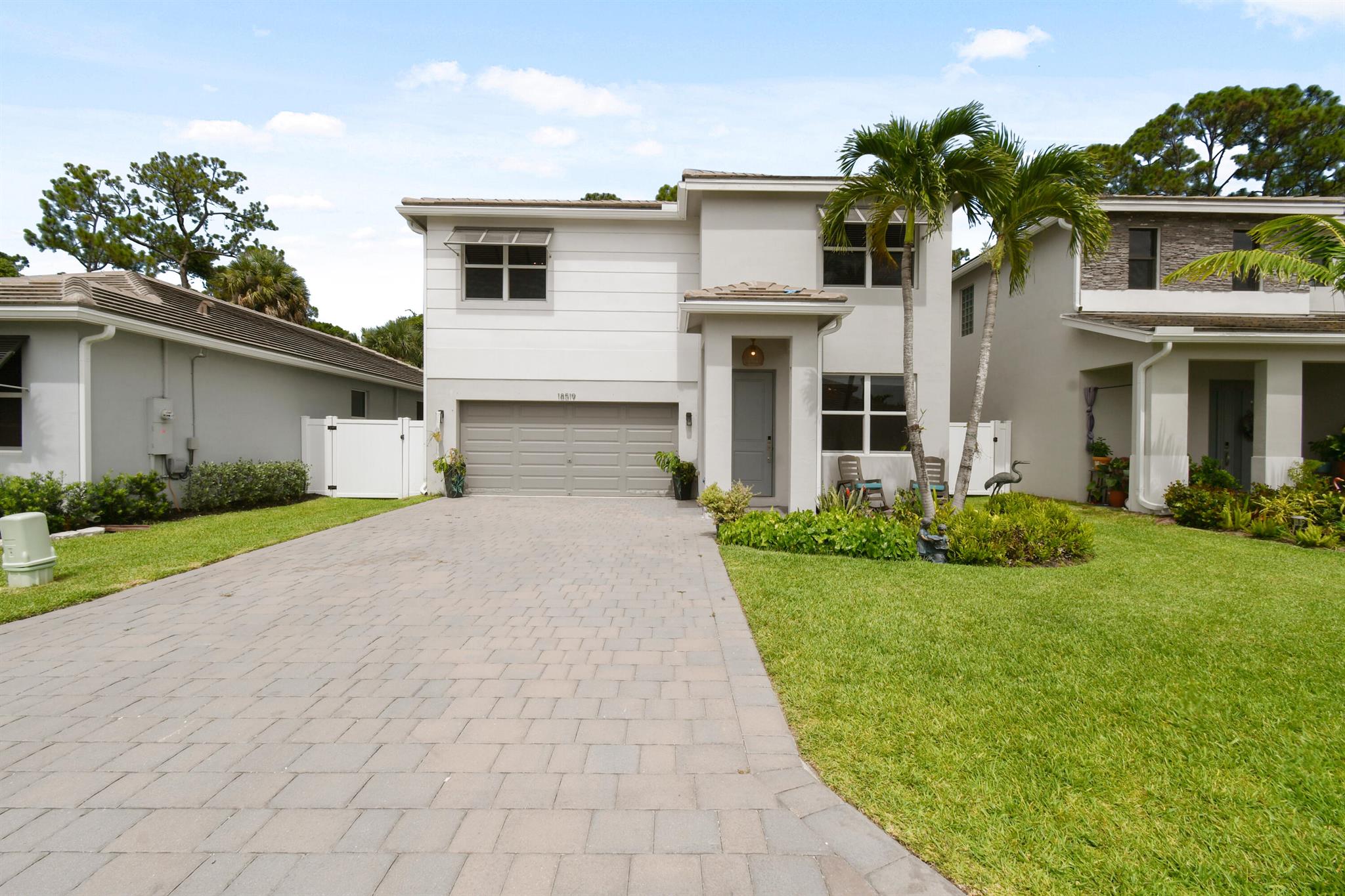 Modern coastal living meets comfort and style in this beautifully upgraded 5-bedroom, 3-bathroom home in The Reserve at Jupiter. Built in 2023 with solid CBS construction and over 2,700 square feet of bright, open living space, this home offers the perfect layout for families or anyone who loves to entertain.Step inside to find clean, white tile floors throughout the main living areas, enhancing the light and airy feel of the open-concept design. The first floor includes a spacious living and dining area, a sleek kitchen with a large walk-in pantry, and a full bedroom with adjacent full bath ideal for guests or a home office. Upstairs, you'll find the expansive master suite, three additional bedrooms, two full bathrooms, a versatile flex space, and a conveniently located laundry room.
This home includes thoughtful upgrades such as custom blinds, impact windows and doors throughout, and extended front and back patios giving you even more outdoor living space to enjoy Florida's year-round sunshine. The fully fenced backyard offers privacy and plenty of space to build your dream pool.
Located in a gated community with a playground, dog park, and outdoor recreation area and just minutes from top-rated schools, beautiful beaches, shopping, and dining this home combines coastal charm, modern convenience, and unbeatable location