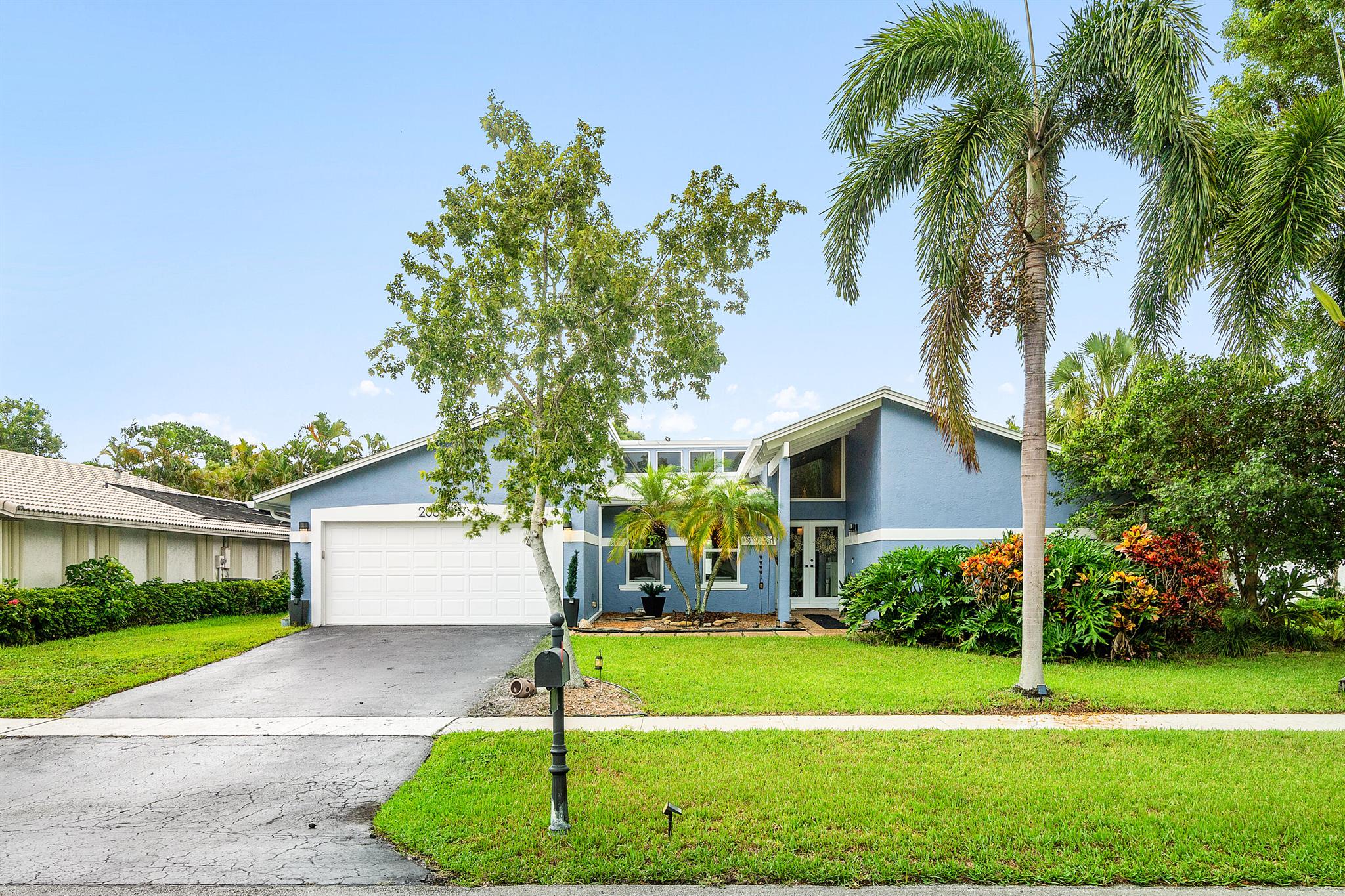 Welcome to this rarely available floor plan in the highly desirable gated community of Paseos. Not only does this beautiful 4 bedroom, 2 bathroom home feature a renovated kitchen & renovated bathrooms, but it also has a brand new roof installed in 2023, full impact windows, 2018 AC units, 2024 gutters, a separate laundry room, walk in primary closet, and so many more great features. This floor plan has not been on the market in years, it is one of the few homes in the community with stunning vaulted ceilings featuring skylights allowing an abundance of natural light to flow through the home! Paseos is conveniently located with TWO gated entrances---- One off St. Andrews Blvd & one off Powerline Road, allowing for convient access to an abundance of shopping, resturants, and both I-95 & the turnpike! This beautiful treelined community features a playground/park, tennis &amp; pickleball courts, walking paths, and so much more. Low HOA of only $217 a month. Don't miss out on this rare opportunity to own in Paseos, a community that averages only 2 sales a year!!! Come take a look TODAY!