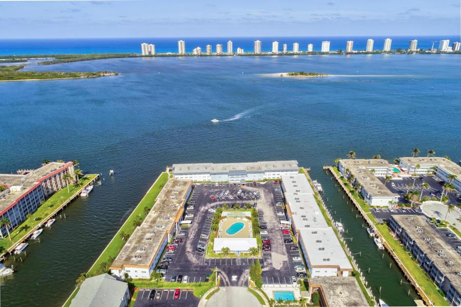 What a view! The closest to living on a cruise ship and staying on land!  This adorable 3rd floor 1 bed 1 bath condo with an open floor plan is all about the views! Direct intracoastal waterway views overlooking Singer Island and Munyon Island. Spectacular sunrises and moonrises! Shore Club is as active 55+ intracoastal waterfornt community ideally located in NPB. Conveniently located close to fabulous restaurants and shopping,  beautiful beaches and world class golf. MIns to PBIA. cable, internet water trash and sewer incl in coa