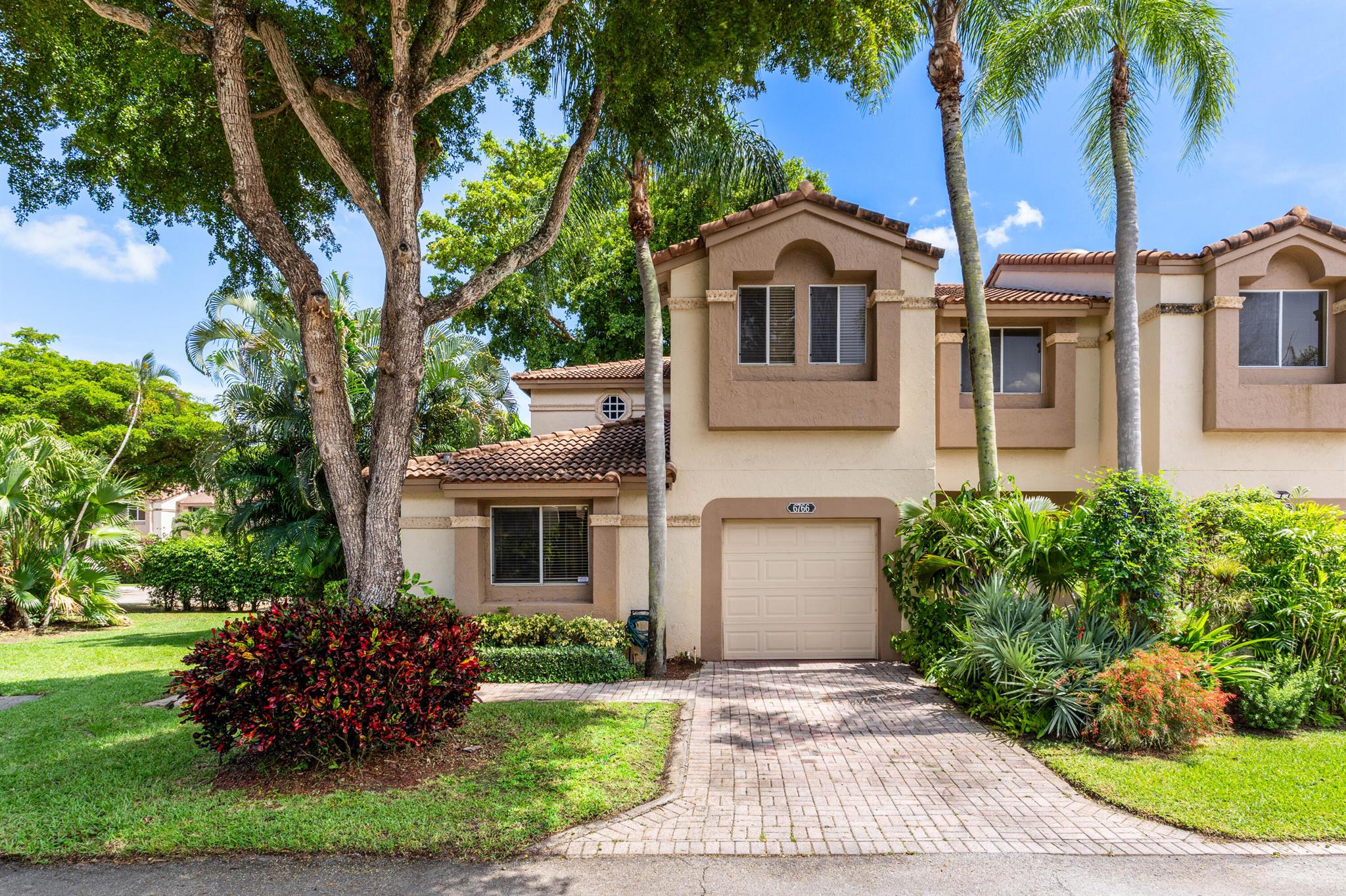 Welcome to this fully updated corner townhome located in the esteemed gated community of Boca Pointe. The spacious residence has been thoughtfully renovated with modern finishes, open concept living and an abundance of natural light. The original 3-bedroom, 3-bathroom floor plan has been thoughtfully modified to include a fourth bedroom, offering added flexibility and space. If preferred, it can easily be restored to an oversized primary retreat at the seller's expense. Unwind on the screened-in porch, offering a comfortable and private space for outdoor living, dining, and relaxation. The entire unit has been re-piped, replacing all polybutylene plumbing with modern, durable materials for added peace of mind and reliability. Enjoy the benefits of a prime location and community amenities.