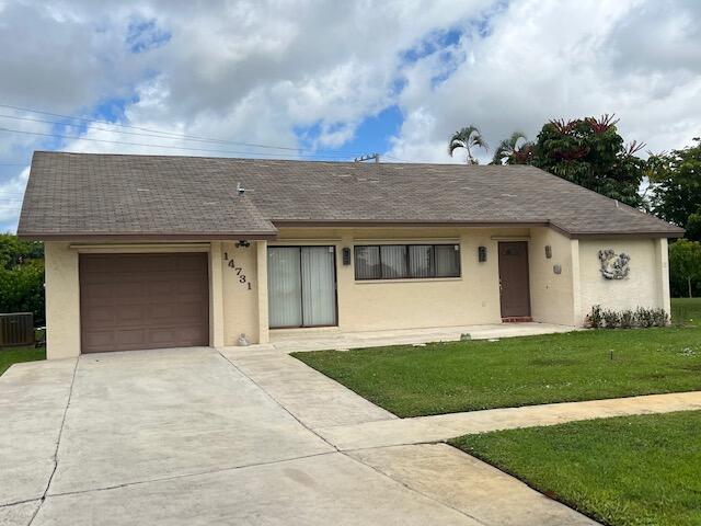 Spacious single family home on a .35 acre lot! Highly sought-after model with vaulted ceilings, an open kitchen/family room, and sliders in every room leading onto the oversized screened-in patio. very large (3/4 of an acre)fenced in backyard with room for a pool. Beautiful redone Master bathroom with double sinks.  Double-wide driveway. AC 2007 Located in Coco Wood Lakes, a very pet friendly, 55+ community with a clubhouse, pool & spa, exercise room and seasonal entertainment. Minutes to the Delray Marketplace and the Florida Turnpike, and only 15  minutes to trendy downtown Delray and the beach.