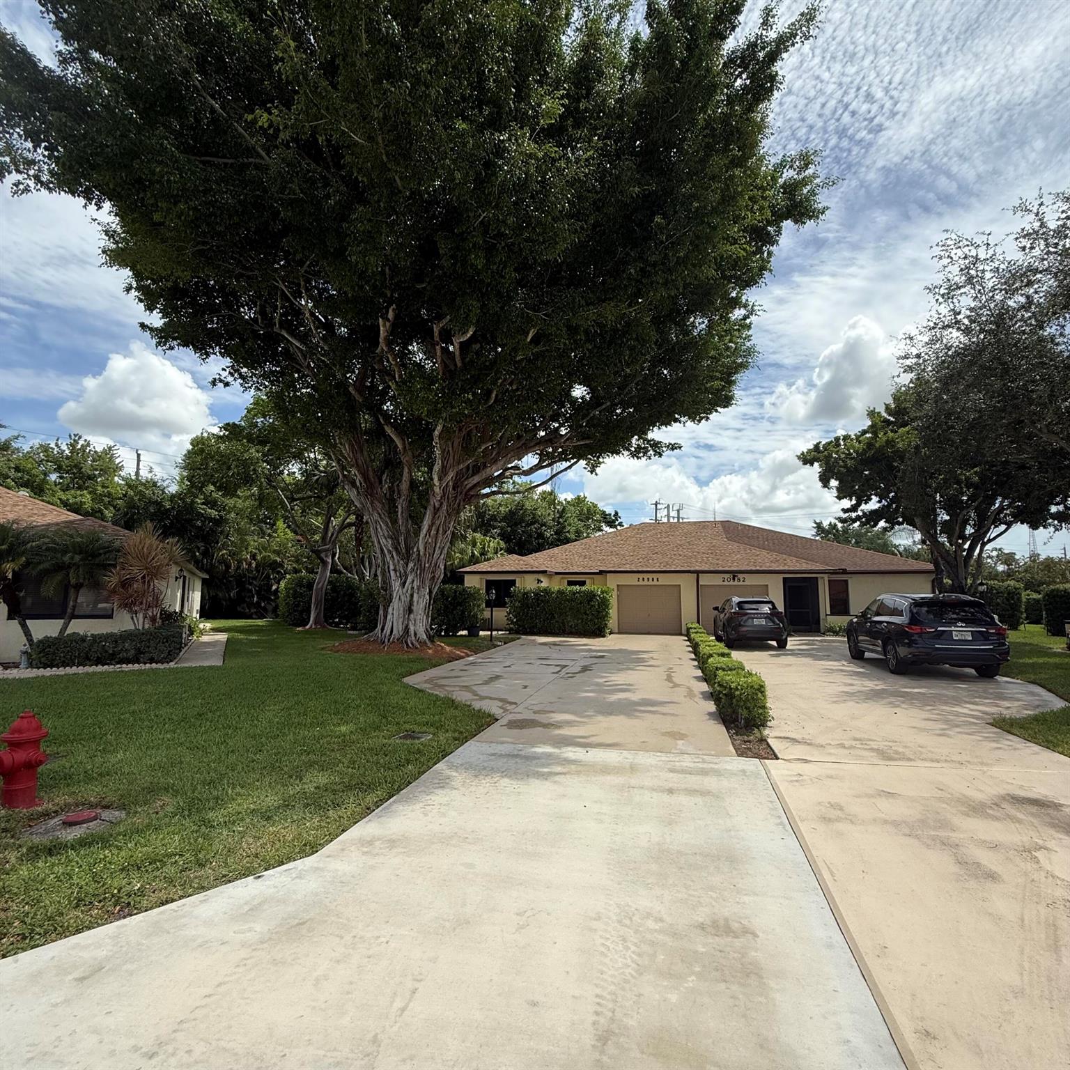 Stunning 3BR/2BA villa with den in sought-after Concord Green, Boca Raton! Located near A-rated schools and exciting new shopping and dining. Features include hardwood flooring, vaulted ceilings, an open kitchen layout, and two private patios surrounded by lush Clusia hedges that create a serene, private outdoor oasis. The versatile den is perfect as a home office or guest room. Enjoy resort-style amenities including a pool, tennis courts, and peaceful walking paths. Low HOA includes 1,000 Mbps internet and cable TV! Pet-friendly and move-in readya''this Boca gem is a must-see! Showings start July 17th. Open House July 19th.