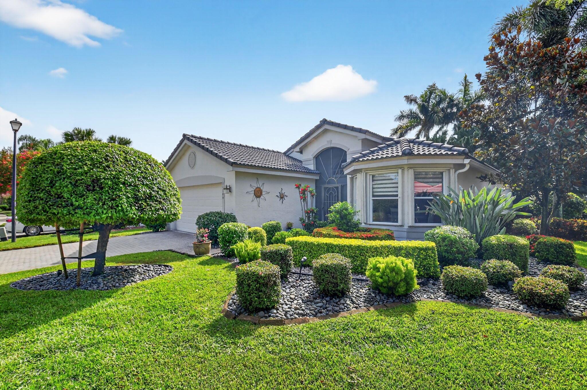 Welcome to 11184 Ihilani. This home sits on a large corner lot and has outstanding curb appeal. The landscaping is lush and is manicured to perfection with flowers and shrubs surrounding the property. They are spectacular. Your most discriminating buyer would appreciate the taste and quality that went into decorating this home. From the neutral paint colors to the designer window treatments; everything is to perfection. The kitchen has been remodeled with dark wood cabinets and stainless steel appliances. The cabinets have plenty of pullouts. This Adriatic model  has three bedrooms and two baths. The third bedroom is currently being used as a den. All three bedrooms have beautifully  customized closets. The bathrooms have been remodeled and they are quite luxurious. Roof about 2 years old There is a 16' x 9' lanai off the great room. This lanai overlooks the gorgeous park like setting with so much privacy and no homes behind it. This home is located very close to the Valencia Isles clubhouse; where you could easily walk to play tennis, pickleball, or take a swim in the resort style pool. Valencia Isles offers a wonderful active lifestyle in our beautifully remodeled clubhouse. The Bistro cafe is open daily for breakfast and lunch, and they offer dinners about once a week. There are many clubs and activities to choose from.
This home also features a complete water filtration system.  The furniture is negotiable.
Buyer must make capital contribution at closing. Equal to two quarterly HOA payments.