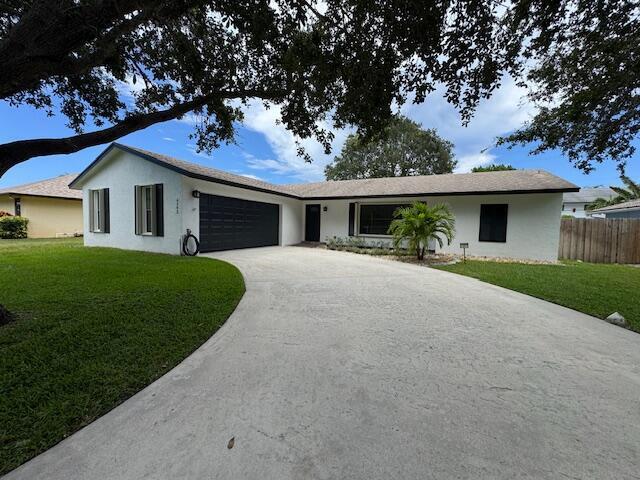 Tequesta Florida nestled in a serene neighborhood. 5 minutes from the beach, little hometown shops like Perk Coffee or Gallery Grille and even a great Park! The exterior boasts a charming new white paint with windows that allow natural light to flood the interior. The front yard is meticulously landscaped, featuring two beautiful trees that shade up the long driveway! Inside this beautiful 3 bed, 2 bath home is adorned with elegant tile. Fully renovated bathrooms. Kitchen is a dream equipped with granite countertops and an open floor plan to the dining room table. The backyard is an oasis for relaxation and even grilling a perfect meal! Don't miss out on the beautiful home.
