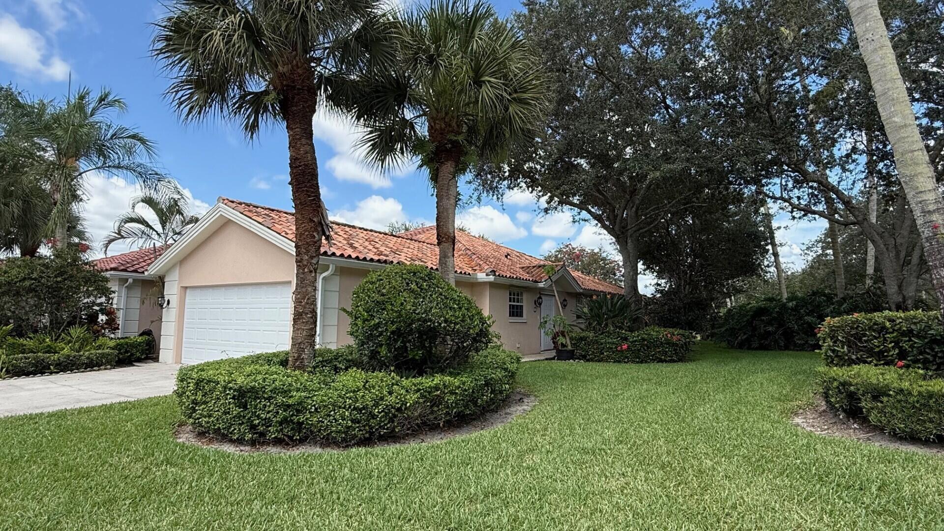 This Extended Capri floor plan has the unique situation of being located on a corner with a tremendous view of open green space!  Extremely quiet and close to the park just north of Riverwalk Circle there is a peaceful view from every window!This home features the sought after 'expanded' air conditioned space off of the dining area.  The kitchen opens to the Great Room with cathedral ceilings and dining area, perfect for entertaining.  Luxury vinyl plank flooring is throughout the whole home.  There is a screened patio overlooking the lake and lush landscaping, an ideal spot for early morning coffee or winding down with a glass of wine while watching the sun set.  The principal bedroom has an en suite bathroom with walk in shower and double sinks, large walk in closet. The guest suite is located on the opposite end of the property from the principal bedroom and has a large walk in closet as well as a private bathroom.  The laundry room has extra cabinet storage and a utility sink.  The home also has a central vacuum and central alarm system.
The heart of this unique residential community is its waterfront Town Center where you can grab lunch  or dinner at the on-site "Centanni" Italian restaurant; enjoy the tennis and pickle ball experience on the eight Har-tru lighted courts with on-site tennis instructor and active tennis program. Take a swim in one of the three heated pools, fish from one of the many picturesque bridges; stop by the library, play ping pong or pool. Also located in the Town Center is the full service Illustrated Properties real estate office, beauty salon, mail facility and children's playground. Enjoy 12 miles of scenic pedestrian pathways, take a bike ride or enjoy a vigorous work out in the renovated fitness center or play bocce - all for the exclusive use of River Walk residents! Yoga, mahjong, bridge, aqua aerobics, foreign language classes, crafts and more are some of the other fun activities offered!  River Walk offers luxury resort-style living, without extravagant ''country club'' fees! Conveniently located near the turnpike, Palm Beach International Airport, the Outlet Malls, Kravis Center, Downtown, and Palm Beach Island.