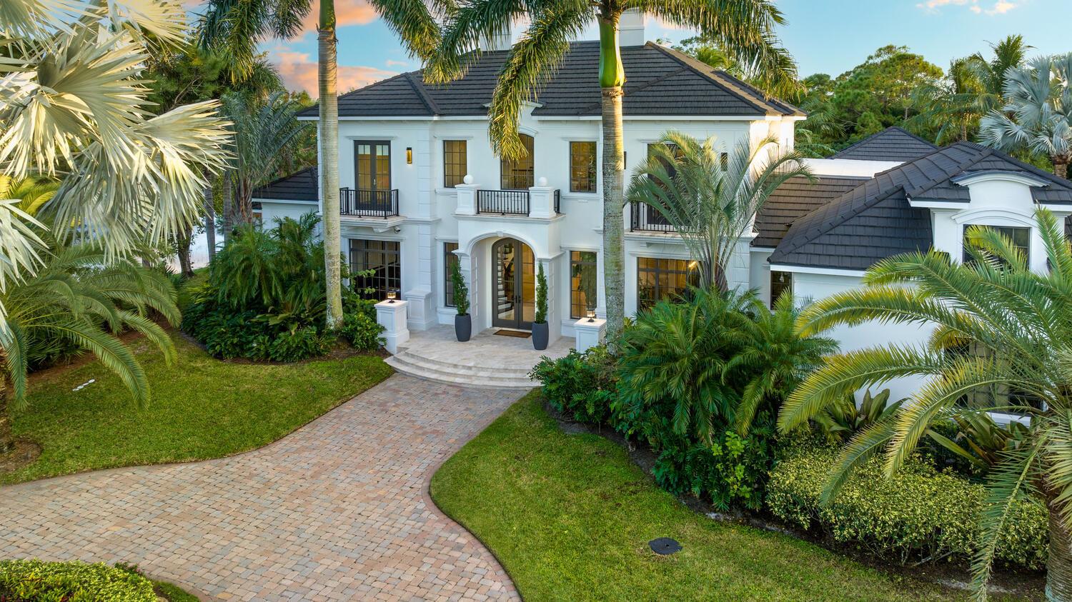 Enjoy the true essence of Florida Living in this exclusive, custom grand estate in the highly sought after gated community of Hidden Bridge. This breathtaking residence features 5 BD, 7 BA & 5,246 LSF (approx.7,000TSF). This stunning home was recently renovated with premier designer finishes and is located on over 1 acre! The tropical backyard oasis features resort style pool, beautiful rock waterfall, exquisitely woven tiki hut & summer kitchen. Upon entering this timeless residence, you are greeted with 20 ft soaring ceilings. This home is the perfect combination of modern yet warm atmosphere. Ideal for entertaining guests with oversized living & bar area. The custom kitchen w/ gas stove & Viking appliances & double islands open to the family area ideal for entertaining friends & family. Enjoy holidays or special events in the formal dining room with exquisite crown molding throughout. The backyard oasis complete with oversized resort style pool, spa and breathing rock waterfall are the ultimate place to relax at home. Sit on the comfy lounge chairs surrounded by the beach underlay or enjoy a time out in the unique wooden tiki hut complete with seating for a large party and calming serene breezes and windchimes. The downstairs master features his and her oversized closets and an outdoor seating area with views of the backyard oasis. Work from home with ease in the spacious home office complete with palm tree views. As you walk up the grand staircase to the second story you are greeted by an open flex space perfect for loft, kids area or home gym . The split floor plan has 4 full oversized bedrooms each with ensuite bathrooms. This rare gem provides impeccable internals throughout, central vac, new HVACS, water heater, full house generator &amp; new roof. The 3 car garage with circular driveway and extra parking throughout. The gated community of Hidden Bridge features a gorgeous exclusive gated neighborhood of only 16 homes and low HOA. Don't miss out on this incredible opportunity to own this custom estate. Call today for our private showing.