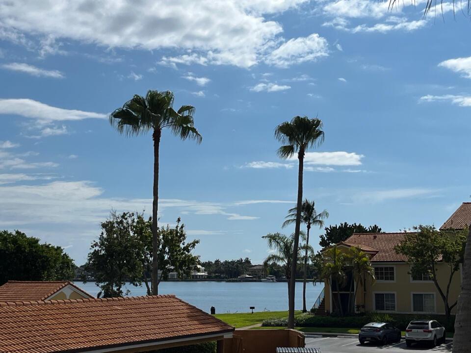 Exceptional opportunity to purchase a 2 bedroom 1 bath condo in the sought after Yacht Club on the Intracoastal. This unit was totally updated with porcelain floor throughout, new SS appliances, new cabinets, quartz countertop, open kitchen, popcorn removed, new vanity with matching quartz and a shower stall with an inlaid stone floor. The unit has intracoastal views from the covered balcony. The Yacht Club has it all from a pool, tiki bar, spa, clubhouse, gym, gated and business center directly on the intracoastal waterway. Other amenities include a marina, tennis courts with night lights, volley ball court, a mediation pond, a dog run and a kiddie play area.. Monthly maintenance includes expanded cable and water.