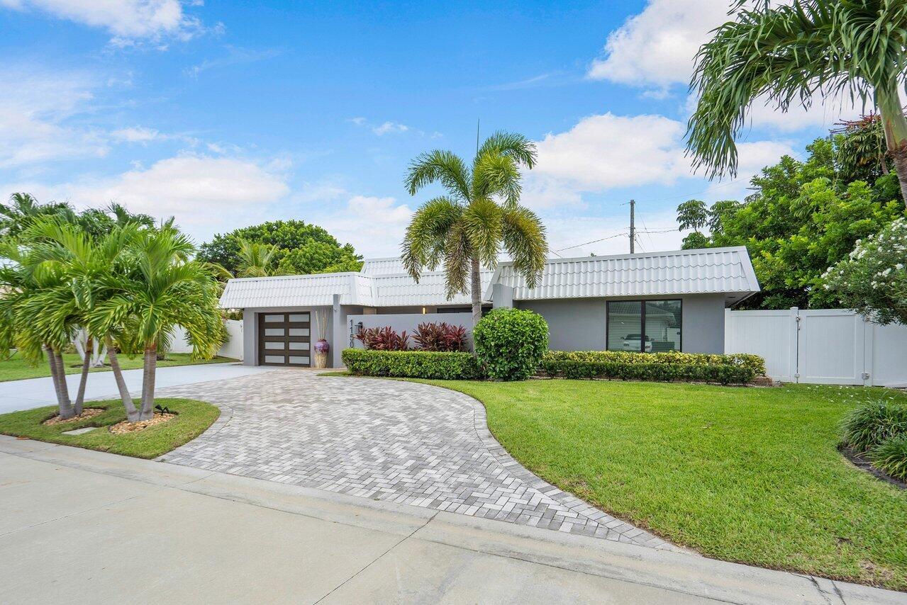 Discover your 3-bedroom, 2-bathroom oasis just steps from Singer Island's pristine beaches. This stunning home features a modern design, contemporary updates, and an open-concept layout. The private yard, with a putting green surrounded by lush greenery, invites relaxation and fun.Embrace coastal charm as the large open concept interior seamlessly blends living, dining, and kitchen areas. Entertain guests or create cherished memories with loved ones.Ample space and natural light in the master suite and additional bedrooms ensure comfort and privacy for all.Indulge in the vibrant community with cafes, restaurants, shopping, and endless activities, then retreat to your private backyard to perfect your putting skills.