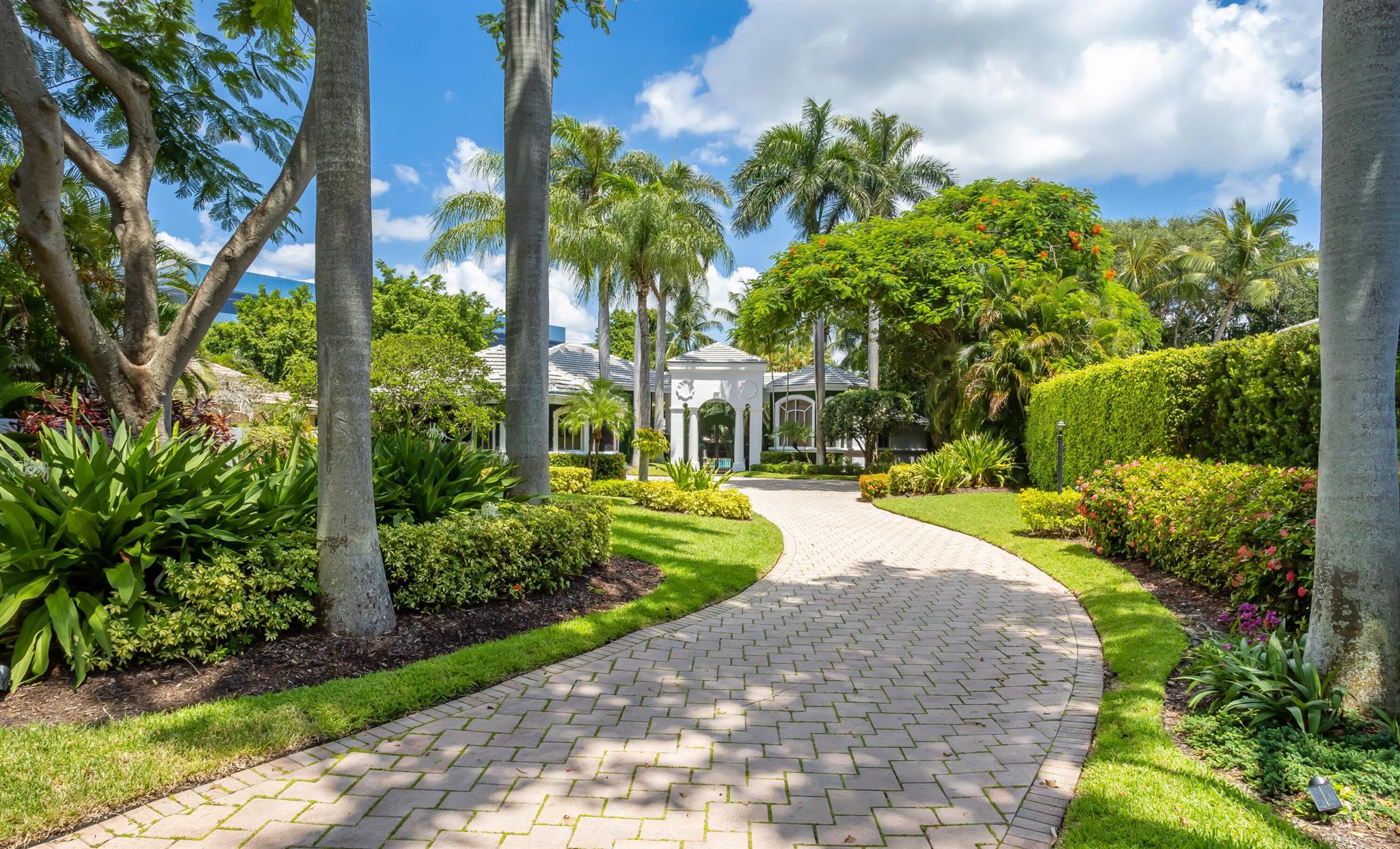 This updated private custom courtyard residence sits on an oversize off-water homesite. The main house blends extensive glass and volume ceiling open space. Located within the only private deep-water gated ultra luxury single family community in Boca Raton. . A resort-style pool and patio continues the serene tropical landscaping and its tranquility. Featured are three bedrooms and a library in the main residence in a two room guest house with exterior entertaining bar and summer kitchen.Seller will consider creative sale terms including a trade or exchange. Additionally, there's a den or library space, which could be used as a private retreat for reading or work. To add to the versatility and space, there's also a separate carriage house that includes two bedrooms. This extra living space could be ideal for guests, extended family members, or staff.

For those who appreciate automobiles, the property offers a four-bay garage, catering to car enthusiasts who want to keep their vehicles in a secure and convenient space.

Overall, this rental property appears to offer a luxurious and comfortable lifestyle within an exclusive gated community. Its beautifully remodeled interior, exquisite furnishings, spacious outdoor area, and additional living quarters make it an appealing option for those who value elegance and convenience.


Courtyard home
Long private driveway
Lush landscaping
Chandelier negotiable
Furniture negotiable

Not impact windows

4 car garage
Iron gate entrance way
Leads to a Courtyard pool
With circular spa
Fenced in backyard
ADT security system
Summer kitchen
Built in grill

1 Rheem AC
2 Rudd AC


Volume ceilings
Floor to ceiling windows
Ceramic floors

Living room
Built in entertainment area
Built in shelves

Kitchen and breakfast area
Marble waterfall island
Center island sink
Under island storage
White shaker cabinets
Built in wine cooler - 18 bottle
GE profile Dishwasher
GE profile electric stove and oven
GE profile microwave
Samsung Refrigerator

Open to Family room

Dining room
Open to living room and kitchen

Office/den
Built in cabinets and shelves
Includes built in file cabinets
Marble tops on cabinets
Wet bar area
Sink
Minifridge
Sliding pocket doors

Primary bedroom
Opens up to pool courtyard
Double doors
2 walk in custom closets

Primary bathroom
Water closet
Toilet and bidet
Walk in shower
Frameless shower doors
Full wall mirror
Double sink vanity
Granite counter tops
Jacuzzi whirlpool
Elevated with steps - marble
Decorative greenery


Powder room

Utility room
Marble countertop
Built in shaker cabinets
Samsung washer and dryer



Bedroom 2/3
Joined by bathroom
Granite top, single sink vanity
Separate shower and water closet

Garage connects to an outdoor sitting area
Covered patio with iron gate enclosure


Guest house
Open living area
Sink vanity
Cabana bathroom
Full bathroom
Walk in shower
Bedroom
Currently as gym
Built in shelves