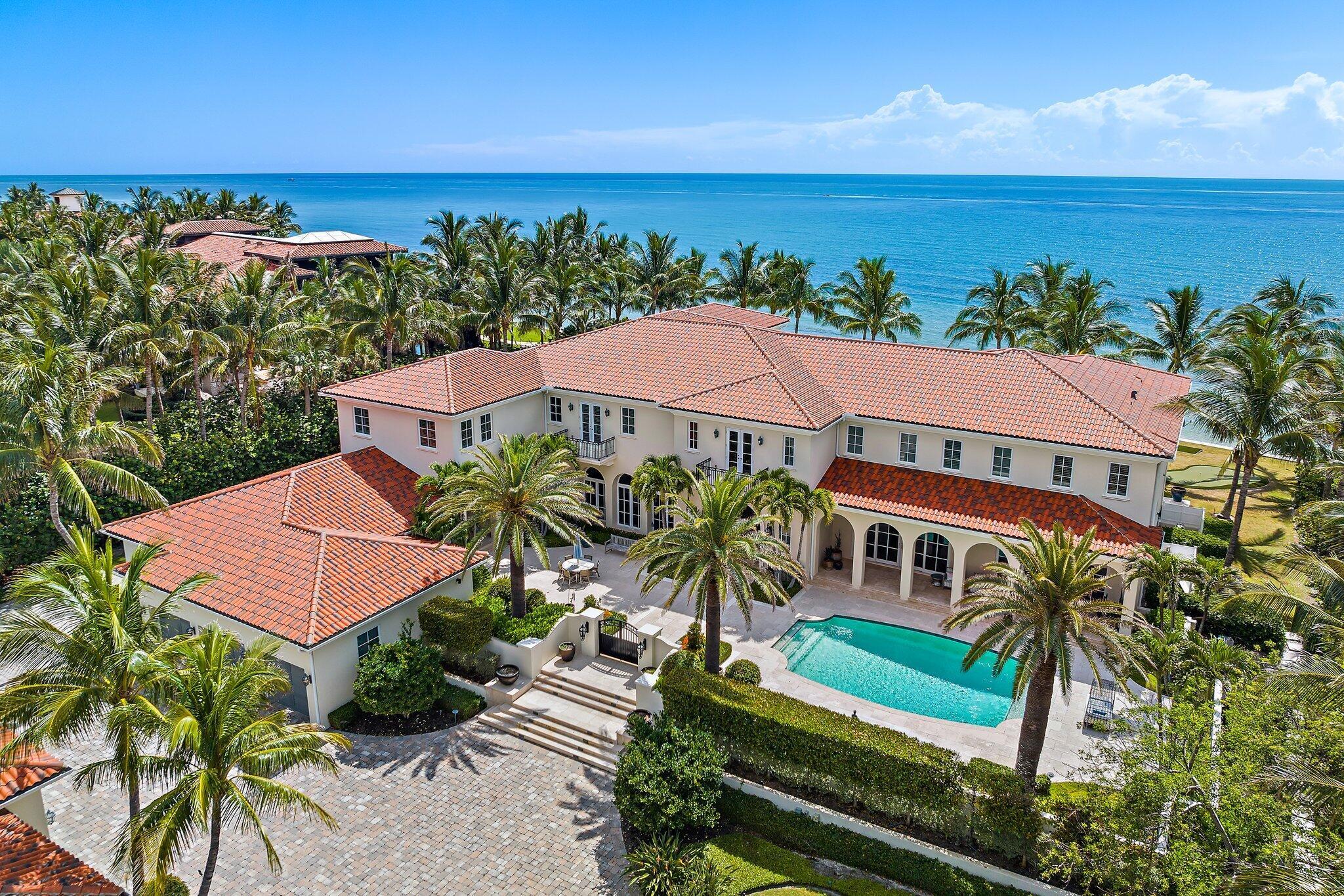 ''Villa Oceano Azul'' -1400 S Ocean Blvd. Manalapan, Florida.  This magnificent estate residence is situated between the Atlantic Ocean and the Intracoastal Waterway in the exclusive estate section of Manalapan.  As its name implies, this extraordinary property totals nearly 2 acres with over 200 feet of direct oceanfront and an accompanying 200 feet on the Intracoastal Waterway equipped with a full-service concrete dock. Offered fully furnished and turnkey with transitional coastal inspired interiors by Marc-Michaels Interior Design, this stunning European-inspired Villa creates graciously proportioned rooms in a grand total of 20,712 square feet with seven bedrooms, nine full and four half baths, including a guest​​‌​​​​‌​​‌‌​‌‌‌​​‌‌​‌‌‌​​‌‌​‌‌‌ house.