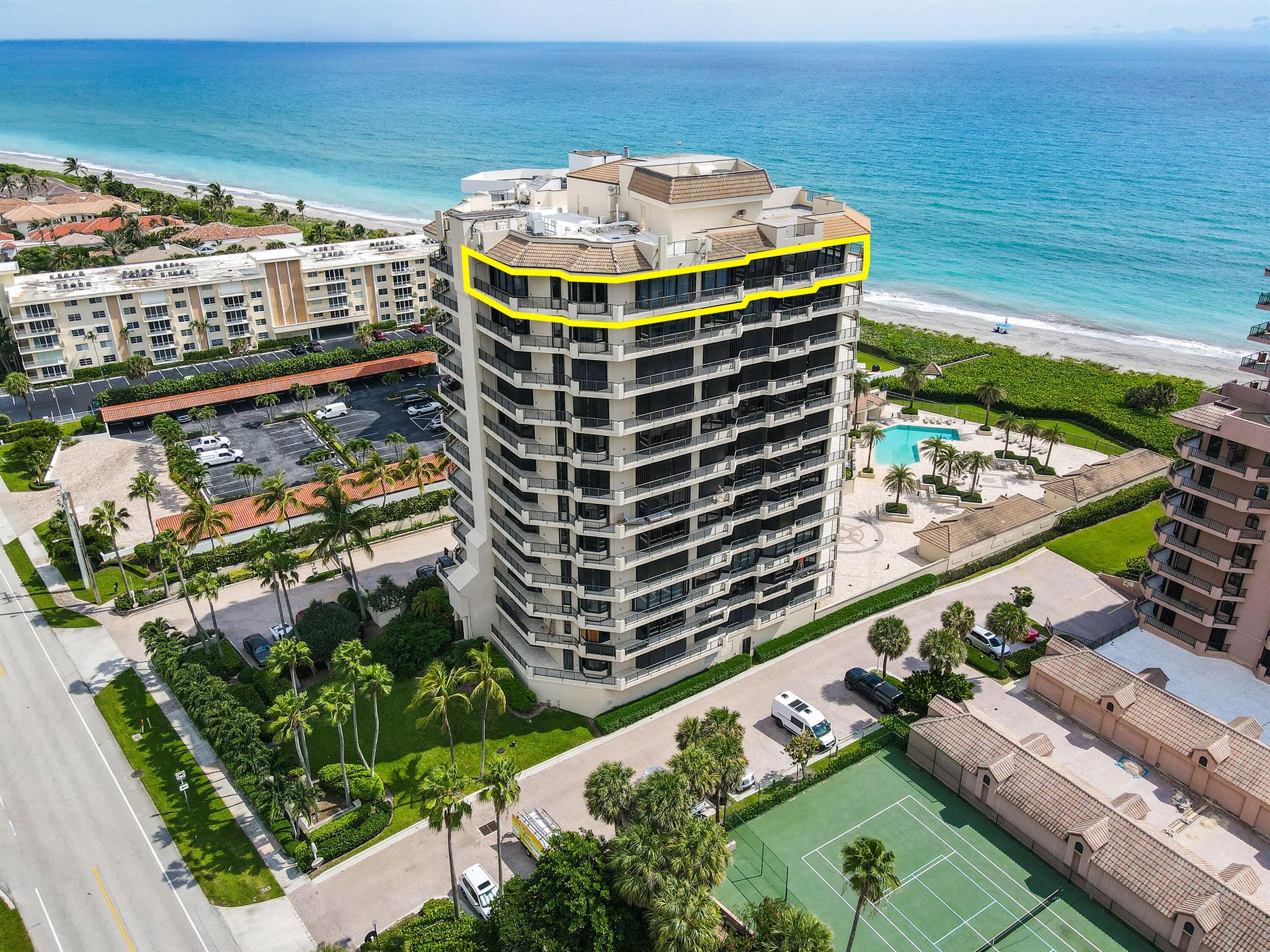 Direct Ocean and Preserve Views from this exquisite penthouse mansion in the sky, nestled in the heart of serene Juno Beach! Rarely available in the boutique and sought-after Oceanfront building, this ultra luxurious residence spans the entire half of the floor and lives like a single-family home on the ocean. Experience a panoramic view and flood of natural light from the floor-to-ceiling glass windows in lieu of walls. Over 1,000sqft of wrap-around balcony offers an outdoor living space with unobstructed views, ocean breezes and spectacular sunrises and sunsets. A rooftop deck, with exclusive ownership access, is additional outdoor space that can be used for entertaining or sky-gazing. Also included with this top-floor penthouse is a private, deeded cabana and an enclosed 2-car garage A privately keyed elevator opens up to a double door entryway, 9-foot ceilings, marble flooring and expansive living areas. The gourmet kitchen features high-end cabinetry, granite countertops and top-of-the-line appliances from Thermadore and SubZero. This open and spacious layout allows for formal and informal dining and living spaces, all with stunning views. A palatial primary suite includes multiple walk-in closets, a built-in vanity space, elegant drapery and a jet tub and separate walk-in shower in the spa-like bathroom. There are 3 additional guest suites and an oceanfront office with customized built-in shelves, offering plenty of tranquil spaces to relax.  Additional home features include a state-of-the-art security system, central vacuum, hurricane accordion shutters, remote control window treatments, stunning chandelier fixtures and a separate utility room with washer/dryer.

Oceanfront is a private, gated community with amenities including a full time Building Manager, a newly appointed gym, his and her saunas, private club room, a newly designed Infinity Pool, a spa and open pool deck with coded access to the beach. Relax in your private poolside cabana with air conditioning, a kitchenette, sitting area and bathroom with shower. The utmost security is provided with coded entrance gates and doors, surrounding property fencing, walls and a gated garage. Elevators are locked so that only owners have key access directly into their residences. A gated garage beneath the building includes a 2-car enclosed garage with automatic door open and easy elevator access directly from the garage. Oceanfront offers the perfect mix of luxury and beachfront lifestyle!