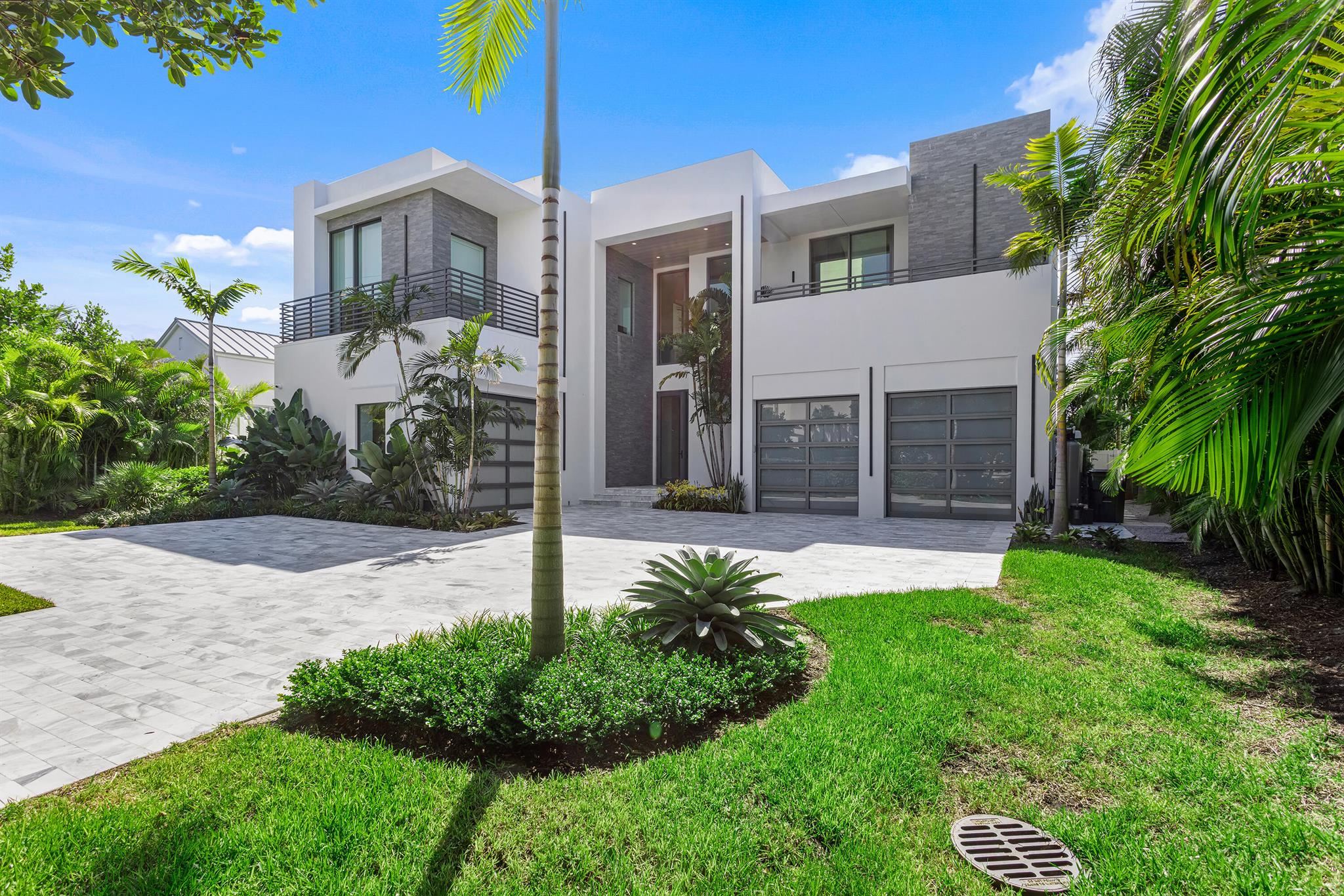 This brand-new five-bedroom Modern-style estate, built in 2022 by Signature Builders Group, is close to the beach and on the waterfront with a dock in Delray Beach's prestigious Estate Section. Three chic living areas, all opening to the pool- and water-view covered loggia, invite indoor/outdoor entertaining, and the primary suite and a guest suite open to private water-view balconies. LOCATION: 

1260 South Ocean Boulevard, Delray Beach, Florida: The sought-after Estate Section in Delray Beach is just steps from the City's pristine award-winning beaches. This premier neighborhood is also just a short drive to Downtown Delray Beach's vibrant Atlantic Avenue, with its array of arts and entertainment offerings interspersed with fine-dining establishments, caf+¬s and bars.

PROPERTY: 

The tropically landscaped gated front yard, with a gray brick drive, presents beautifully, while the back yard features a wonderful entertainment area. The large covered loggia, with automatic screens, features a summer kitchen overlooking the salt-water heated pool and spill-over spa, and a grilling station is on a side loggia. At the end of the canal with 40-feet of waterfrontage, the composite dock can accommodate a boat up to 30 feet. With two garages, one accommodates two cars, and the other garage currently serves as an air-conditioned gym. 

RESIDENCE:  

Built in 2022 by Signature Builders Group, this five-bedroom, 8,580 +/- total-square-foot Modern-style masterpiece features a dramatic open design with walls of floor-to-ceiling impact-glass that bathe the interiors in soft natural light and offer serene water views. Chic details include cerused wide-plank wood floors, custom cabinetry, designer light fixtures, and attractive three-dimensional feature walls. The foyer and stair hall flow out to the great room, with living and dining areas fronted by a bank of sliding doors that open to the pool loggia offering water views. Flanking the great room is the club room, featuring pocket sliding doors accessing the pool loggia, a fully equipped underlit marble-topped wet bar, and a handsome feature wall behind the television. On the other side of the great room is the family room, with an entire corner of glass sliding doors that open to the pool loggia inviting indoor/outdoor entertaining. Just adjacent, the gourmet kitchen is finished with custom cabinetry, marble counters, pantry, professional-grade appliances, and a center cook island with an attached table. On the second floor, a loft living area serves the primary suite, his and her offices, and three guest bedrooms. The water-view primary suite comprises a spacious bedroom opening to a large private balcony, custom-fitted walk-in closets, and a spa-inspired tiled bathroom with an underlit double-sink vanity, walk-through shower, freestanding tub, and separate water closet. His office, with  custom cabinetry, features floor-to-ceiling windows that also offer incredible water views. The guest bedrooms have ensuite bathrooms and private balconies. Completing the layout are an elevator, first-floor guest bedroom suite, second floor laundry room, and a powder room. Amenities include automatic blinds, natural gas accommodation, full-house generator, four American Standard air conditioners, a tankless hot-water heater, LED lighting, and full-house water purifying system.

The information herein is deemed reliable and subject to errors, omissions or changes without notice.  The information has been derived from architectural plans or county records. Buyer should verify all measurements. 

DISCLAIMER: Information published or otherwise provided by the listing company and its representatives including but not limited to prices, measurements, square footages, lot sizes, calculations, statistics, and videos are deemed reliable but are not guaranteed and are subject to errors, omissions or changes without notice. All such information should be independently verified by any prospective purchaser or seller. Parties should perform their own due diligence to verify such information prior to a sale or listing. Listing company expressly disclaims any warranty or representation regarding such information. Prices published are either list price, sold price, and/or last asking price. The listing company participates in the Multiple Listing Service and IDX. The properties published as listed and sold are not necessarily exclusive to listing company and may be listed or have sold with other members of the Multiple Listing Service. Transactions where listing company represented both buyers and sellers are calculated as two sales. The listing company's marketplace is all of the following: Vero Beach, Town of Orchid, Indian River Shores, Town of Palm Beach, West Palm Beach, Manalapan Beach, Point Manalapan, Hypoluxo Island, Ocean Ridge, Gulf Stream, Delray Beach, Highland Beach, Boca Raton, East Deerfield Beach, Hillsboro Beach, Hillsboro Shores, East Pompano Beach, Lighthouse Point, Sea Ranch Lakes and Fort Lauderdale. Cooperating brokers are advised that in the event of a Buyer default, no financial fee will be paid to a cooperating Broker on the Deposits retained by the Seller. No financial fees will be paid to any cooperating broker until title passes or upon actual commencement of a lease. Some affiliations may not be applicable to certain geographic areas. If your property is currently listed with another broker, please disregard any solicitation for services. Copyright 2022 by the listing company. All Rights Reserved.