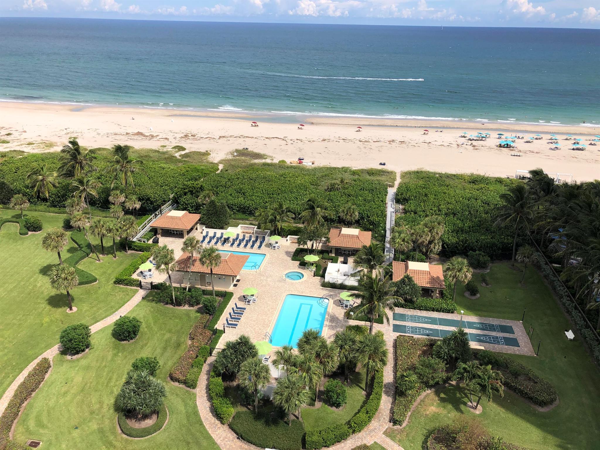 Ocean view as well as spectacular Intracoastal views from this lovely 2 bedroom, 2 bath condo on the 17th floor in Oceantree Condominium; desirable South side with direct sun; beautiful sunets! Newly remodeled hallways throughout the building! Oceantree has the best ocean beach and grounds on Singer Island--large private sandy beach with beach services included and over 6 acres of beautifully landscaped grounds with 2 heated pools, hot tub, picnic gazebos with gas grills, shuffleboard,bocce ball, tennis courts, and garage parking as well as saunas, exercise room, 24 hour concierge, and full time manager.  This unit is offered turnkey, ready for you to rent or to move right in and enjoy! Won't last long as owners have just reduced the price by $98,000. This is a must see!