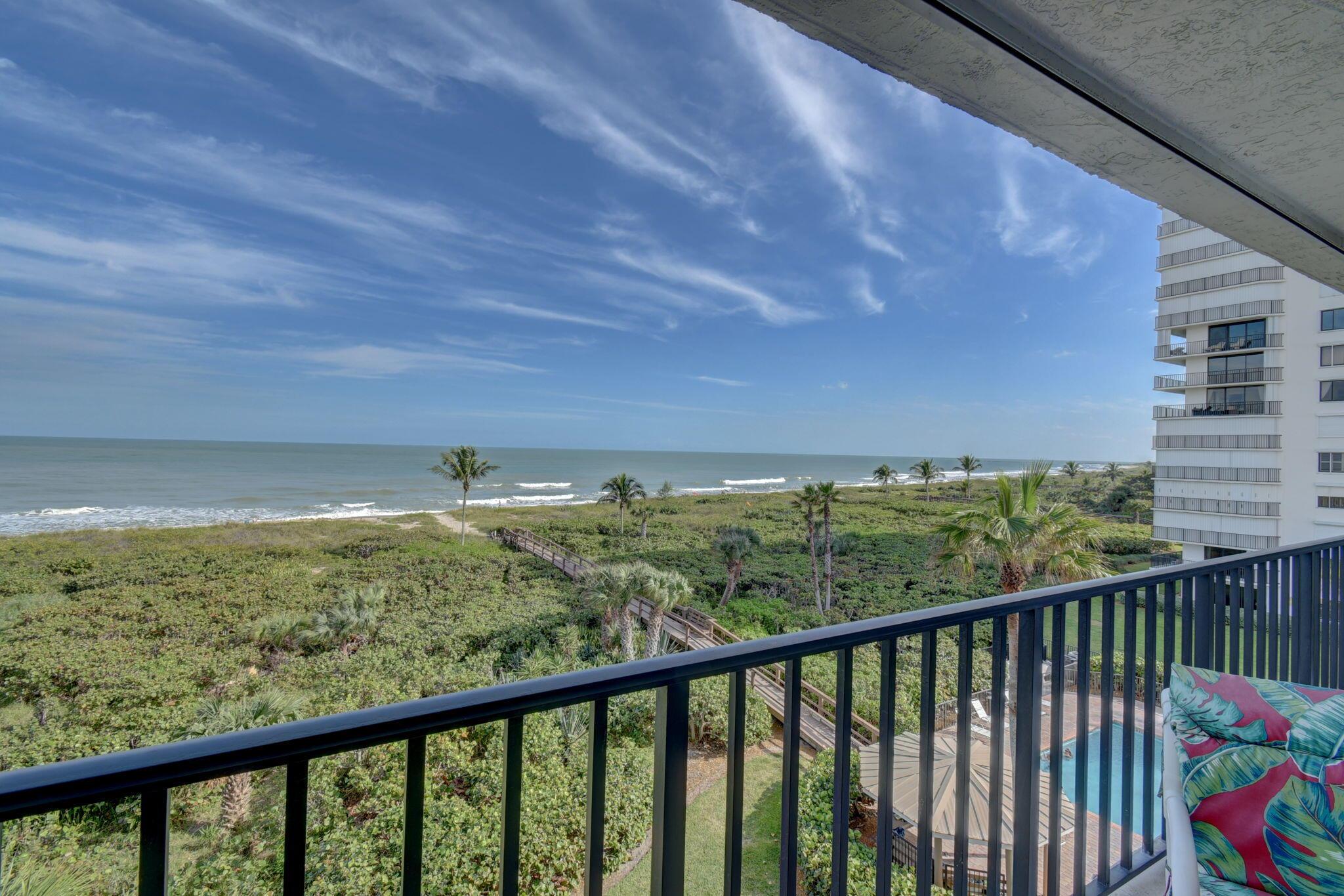 Don't miss this amazing opportunity just reduced  to 540k...an absolutely gorgeous, OCEANFRONT 3 Bedroom, 2 bath Condo located in Tiara Towers, a Luxury Oceanfront Condominium Complex on North Hutchinson Island with two towers and direct access to the beach.  The views from this fifth floor home are spectacular, with a perfect viewpoint just above the palm trees and unobstructed direct views of the beachfront and ocean.  Enjoy the sunrise and a cup of coffee from your oceanfront terrace or head down to the sand for breathtaking views.  Updated features include a brand-new A/C unit just replaced in 2023, a new hot water heater replaced in 2022, updated kitchen appliances, laminate flooring throughout,,  freshly painted & new textured ceiling. This unit is move-in ready