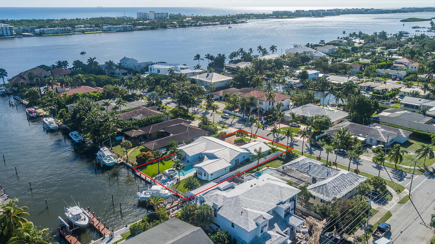Open and airy, this magnificent Lake Worth Beach waterfront home was built for entertaining! Walking in the front door your eyes fixate on the water views in the distance. You are welcomed in the beautiful foyer which leads to the charming ''Florida-formal'' living room and attached dining room. For privacy, the home boasts two first floor primary bedroom suites, one on either side of the home. Additionally, three guest bedrooms plus a separate den/office. The spacious backyard holds a large swimming pool, hot tub, dock and 85 feet of water frontage. Do not miss this opportunity to live directly on the ICW, in College Park, on a quiet cul-de-sac street.