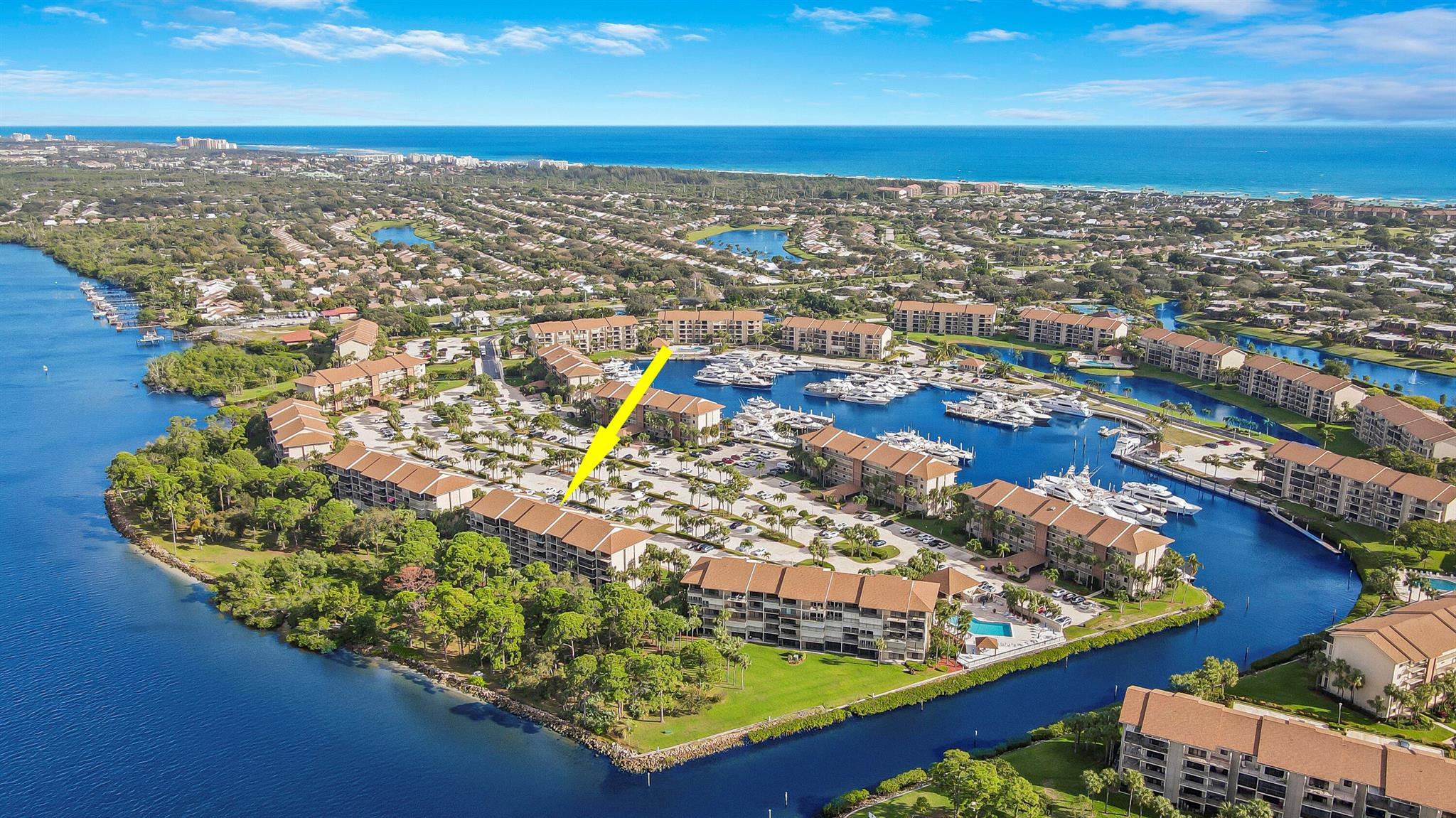 LIVE THE SOUTH FLORIDA LIFESYTLE!  Highly Sought After and Rarely Available FIRST FLOOR END UNIT ON THE INTRACOASTAL!  Relax at the COMMUNITY SANDY BEACH. Take in the Boat Activity, Sights and Sounds of Nature or Grab your Fishing Rod. Enjoy the Waterfront. Cook the Fresh Catch on 1 of the Community Grills and Savor at the Picnic Table. 4 HEATED POOLS/Clubhouses (2 Libraries) and many other Activities. LIGHTED TENNIS COURTS. Bocce Ball.  Hidden behind your front door is a VIEW THAT WILL TAKE YOUR BREATH AWAY. Unit has renovated kitchen, bath, flooring, SS Appliances. 2 Screened patios. Bonus Rm for Office, Storage, Guest Overflow.  WALK/BIKE TO JUPITER BEACHES, Restaurants, Grocers, Pharmacy, Etc.  20 Min to PBI. No need to Rent. Make this your Full Time or Winter Home. JUPITER HAS IT ALL