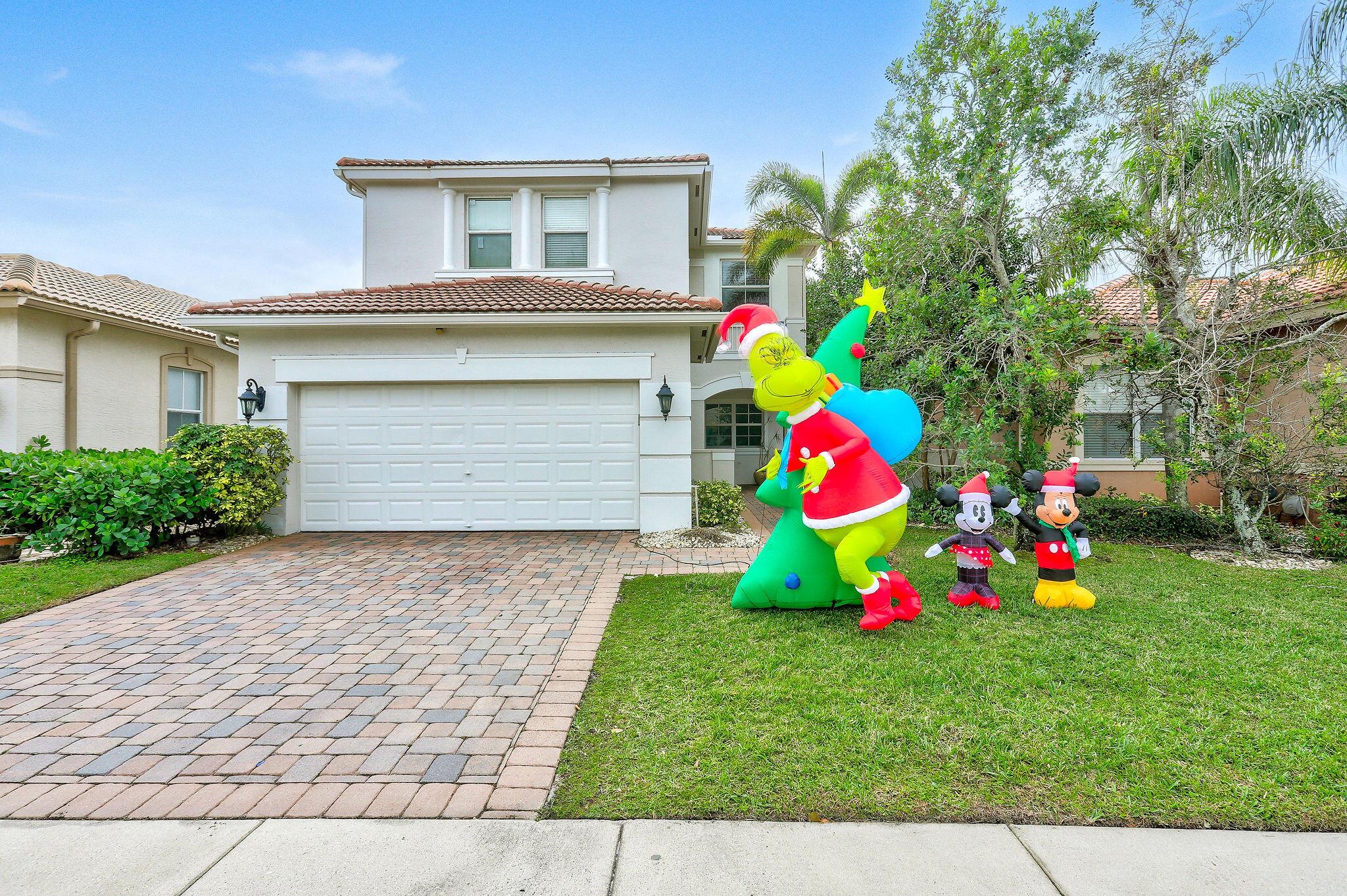 Beautifully updated 4 bedroom / 2.5 bath home located in the desirable gated community of Mirabella in Mirasol. A fully updated kitchen with expanded quartz countertops and newer appliances allow for a greater sense of space, while the large windows across the room provides a scenic lake view.  Many updates done by the current owners include impact glass, custom staircase banister, and much, much more.