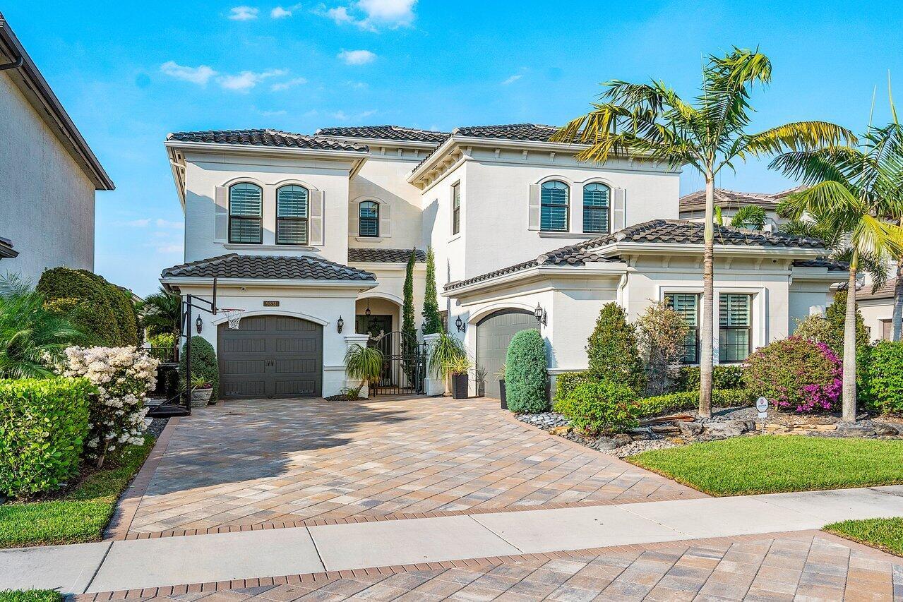 Nestled in a cul-de-sac in the ultimate luxury community of Seven Bridges in Delray Beach, 9831 Vitrail Lane offers a spacious setting to make memories that will last forever with your family and loved ones. Built in 2016, this stunning 5 bedroom, 7.5 bathroom home stretches over 5,233 interior square feet and comes equipped with all of the modern features necessary to live to the fullest.Going up the immaculately landscaped Chicago brick driveway, you'll make your way through a wrought iron gate protecting a covered courtyard entrance. Double doors open into a grand two story foyer where you will find custom light fixtures, wainscoted walls, a wet bar, crown moldings, and hickory wood features that elevate the already majestic space to new heights. Past the foyer, you'll find the open living room, formal dining room, and upgraded gourmet kitchen that are graciously lit by natural light that shines through many impact glass doors and windows. Complete with 42' stacked cabinets, upper and lower cabinet lighting, center island, quartz counter tops, glass tile backsplash, stainless steel appliances, double oven, pantry, and snack bar, this kitchen is truly a chef's dream!

Through the sliding glass doors and into the backyard, the home's patio offers stunning lake views, a sizable seating area with gas hookups for a potential summer kitchen, and a plunge pool and spa.

Upstairs, you'll find the home's bedrooms, with each offering its own en-suite bathroom. The master suite provides the ultimate luxury with coffered ceilings, a seating area, his-and-hers walk-in closets, dual sinks, a roman tub, and a walk-in shower.

Other luxurious amenities of this home include a 3-car garage, club room, full home sound system, full home camera security system, and mudroom. The home includes 24"x24" polished tile and wooden flooring throughout.

Seven bridges is a luxury gated community in Delray Beach with over 700 homes. Featuring a 30,000 squarefoot clubhouse, resort-style swimming pool, 6 har-tru tennis courts, pickleball, a fitness center, yoga studio, and more, this luxuriously landscaped community provides the ultimate security with a 24/7 staffed guardhouse.

Don't let this opportunity slip away!

The information published and provided including but not limited to prices, measurements, square footages, lot sizes, features, finishes, and calculations are subject to errors, omissions or changes without notice. All such information should be independently verified. All parties should perform their own due diligence to verify all information.